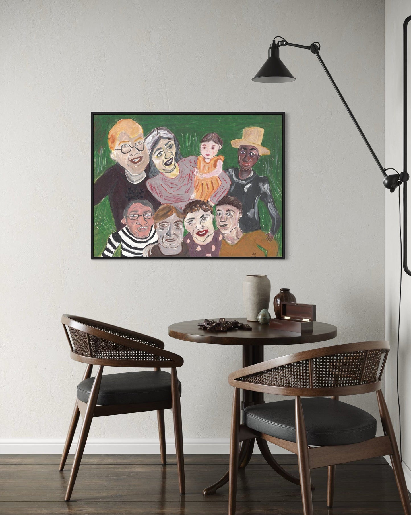 Dining area with a round table and two chairs, featuring a colorful painting on the wall.