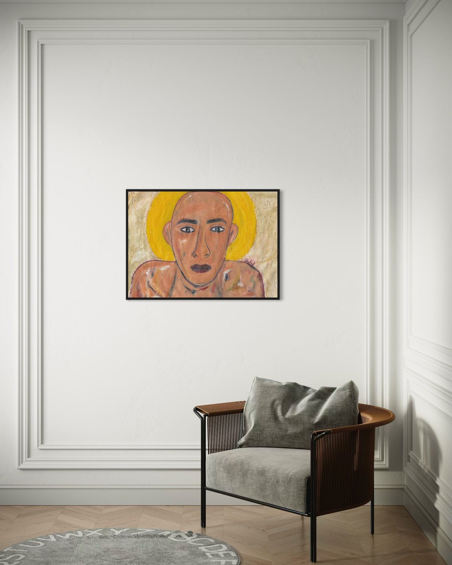 Artistic portrait on a wall above a modern chair with a gray cushion.