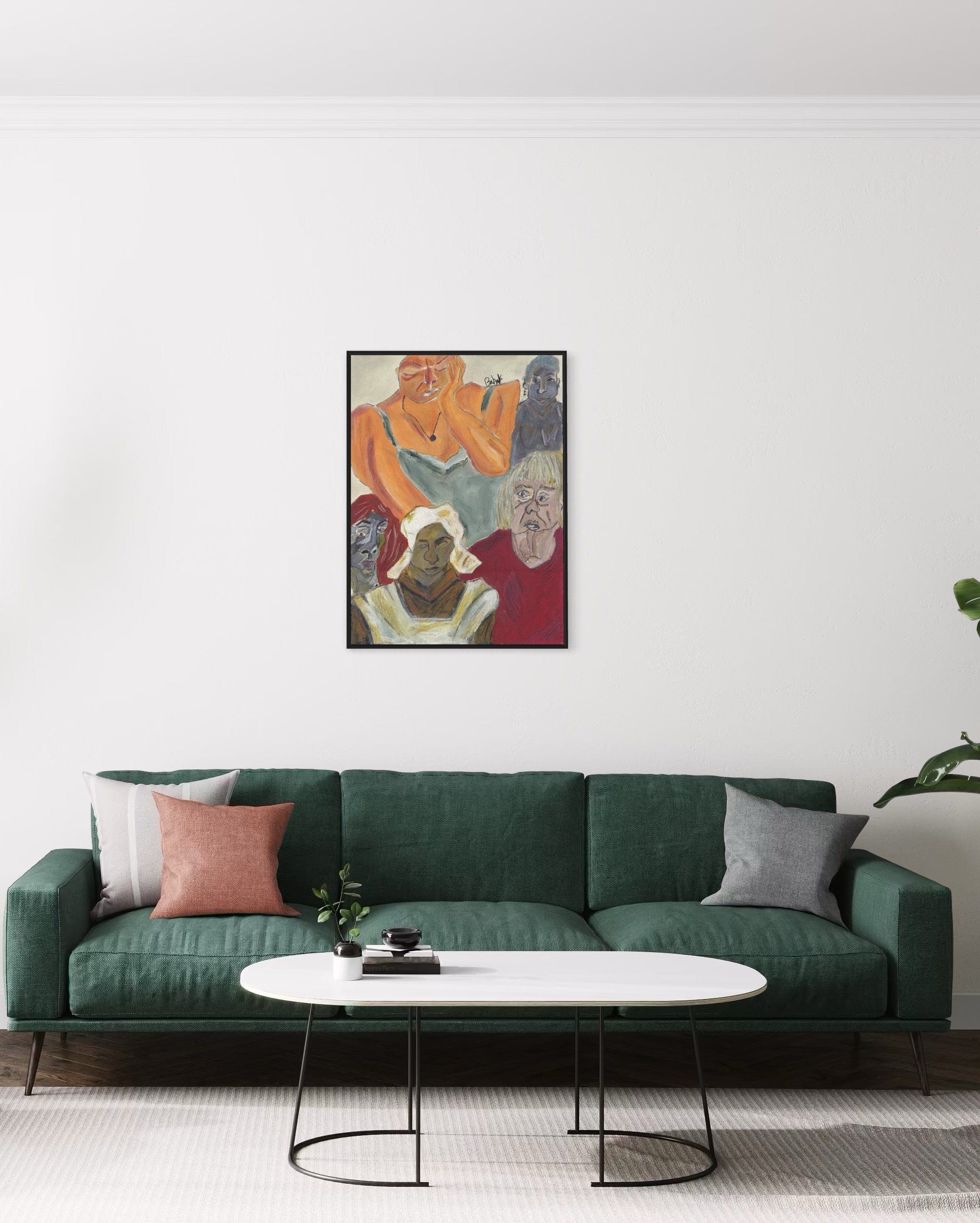 Green sofa with decorative pillows and a coffee table in a living room setting, featuring a colorful abstract painting on the wall.