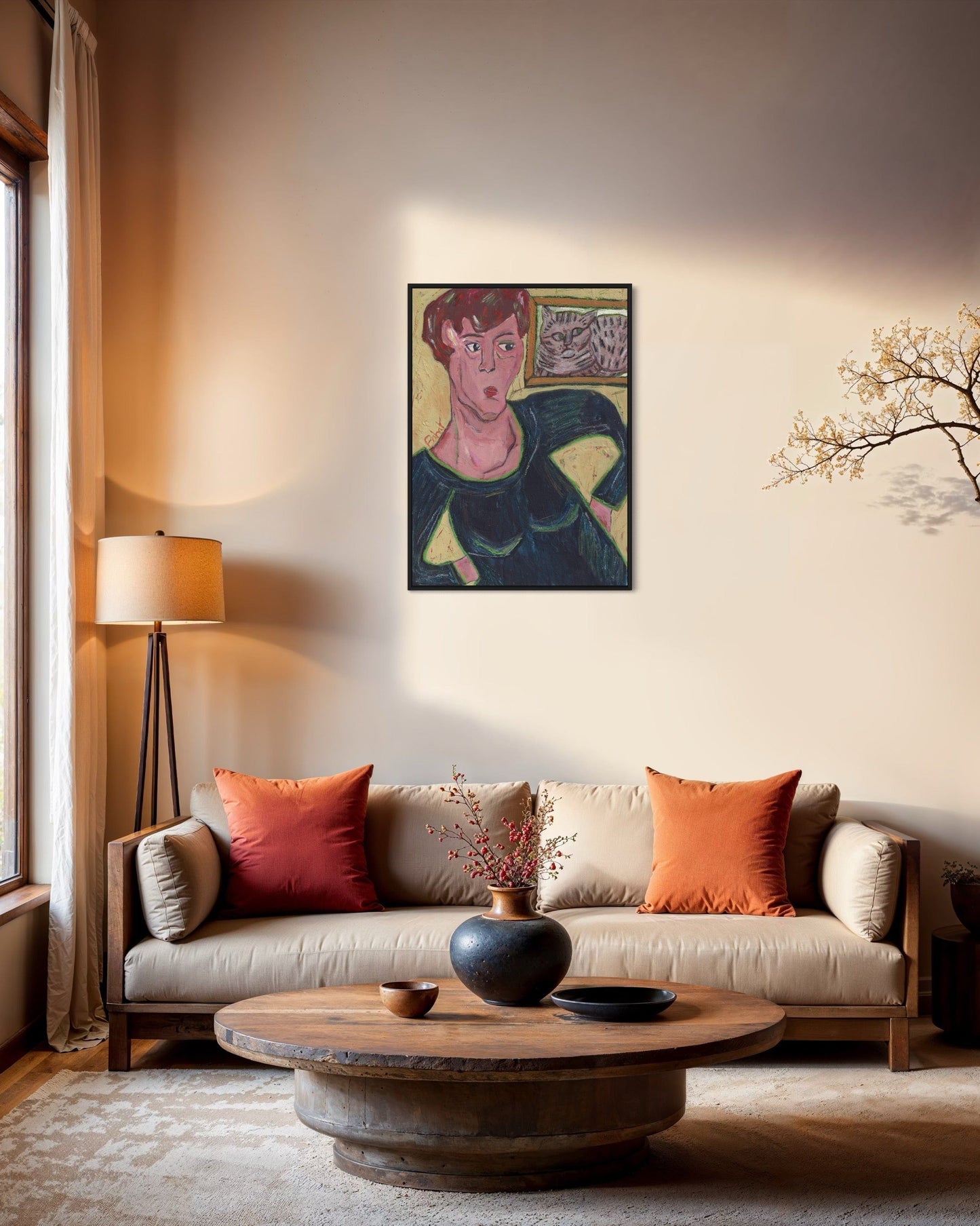 Living room with a couch, coffee table, and wall art