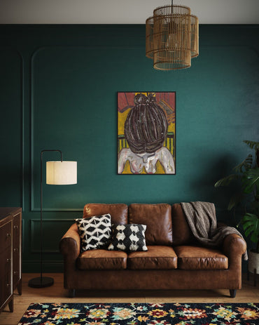Living room with a brown leather sofa, colorful rug, and wall art.