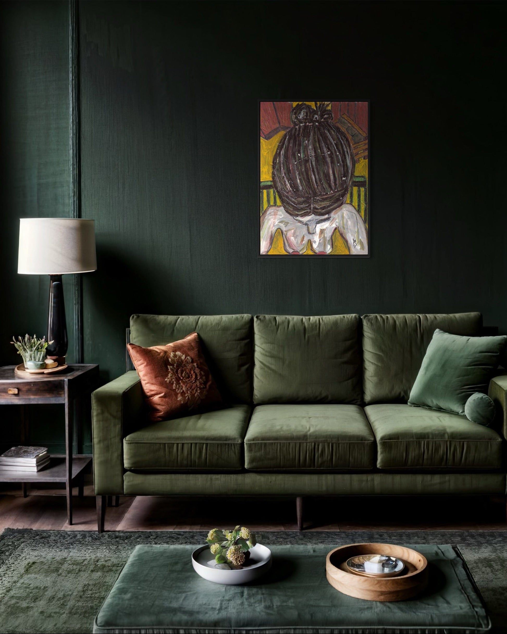 Green sofa in a living room with a dark wall, lamp, and decorative items.