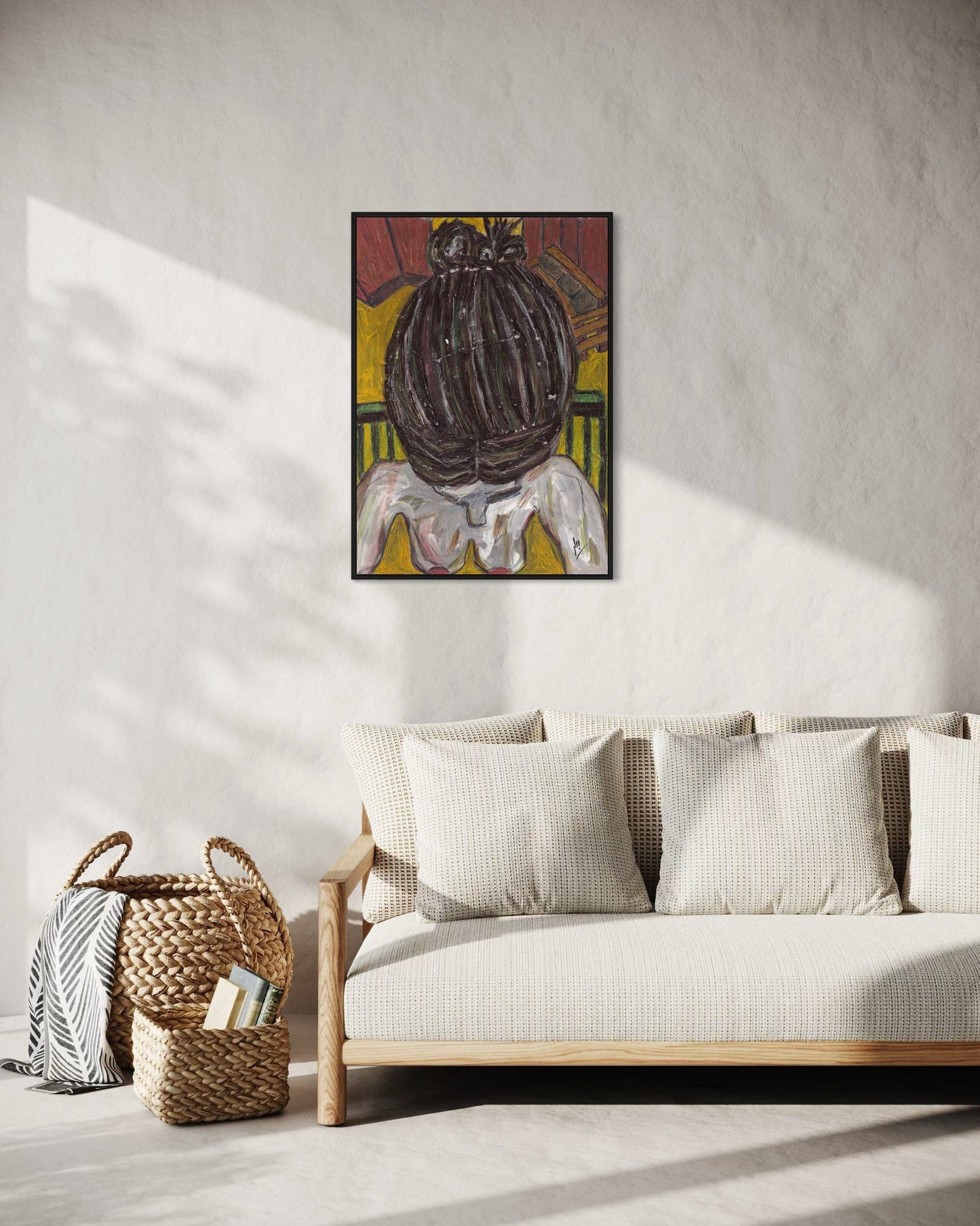 Framed artwork above a sofa in a living room setting