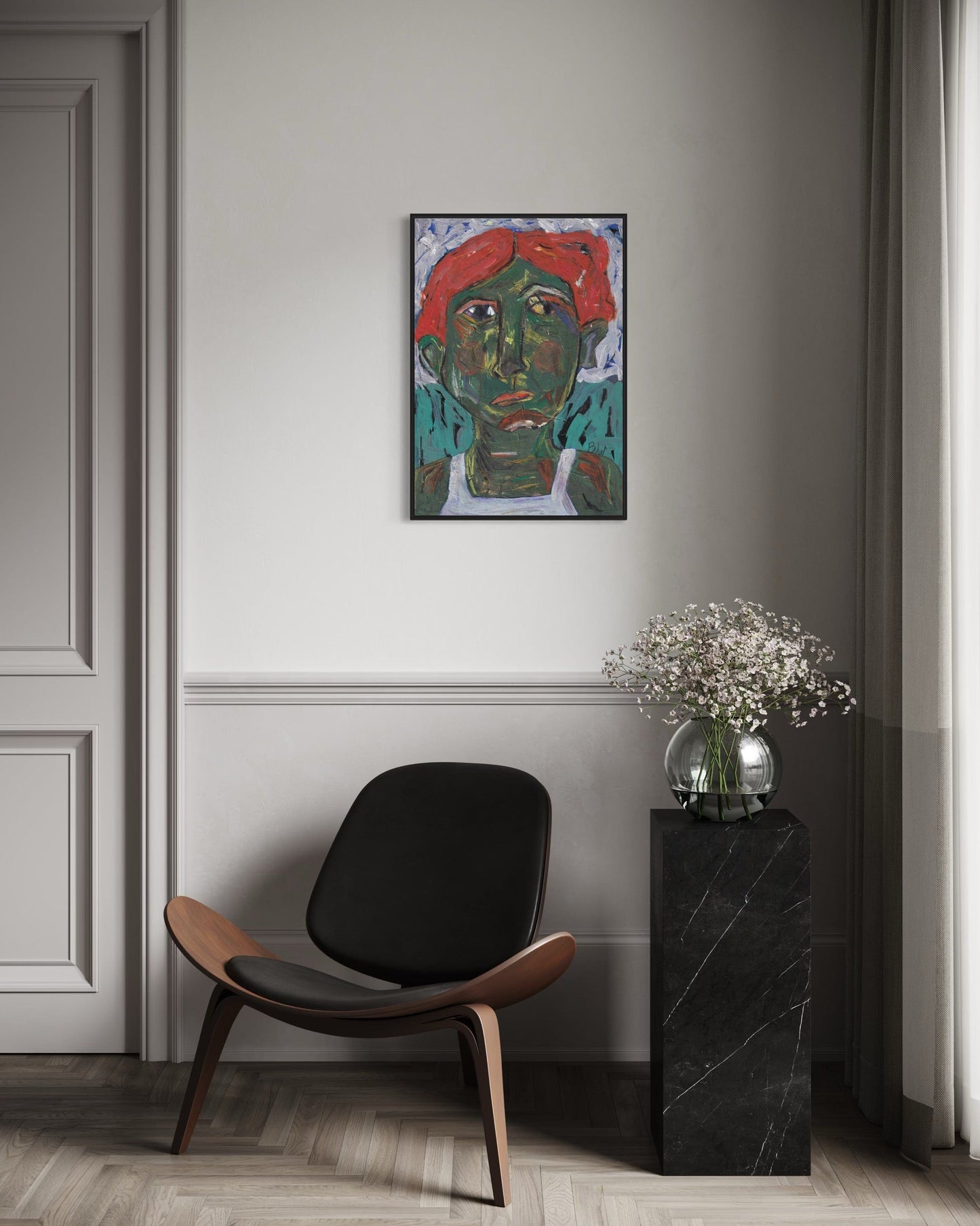 Modern interior with a black chair, marble side table, and colorful abstract painting on a gray wall.