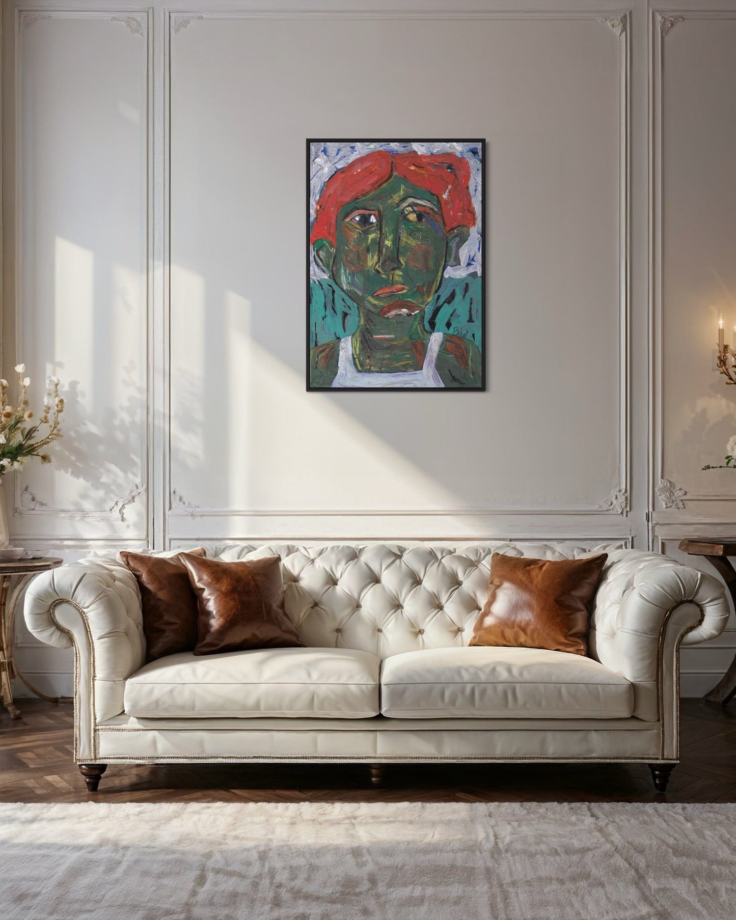 White tufted sofa with brown cushions in a room with a colorful abstract painting on the wall.