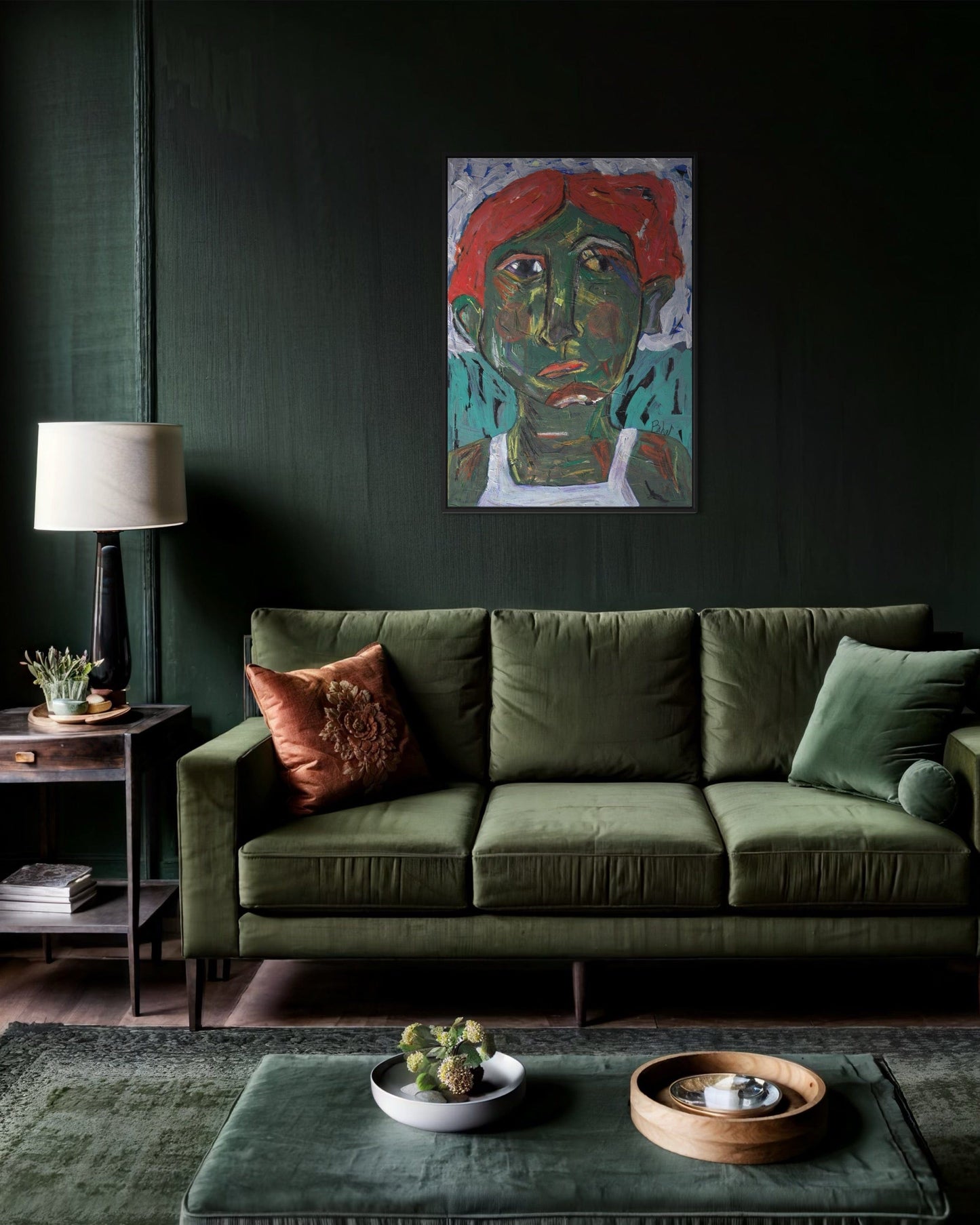 Green sofa in a living room with a dark wall, colorful painting, and decorative items.