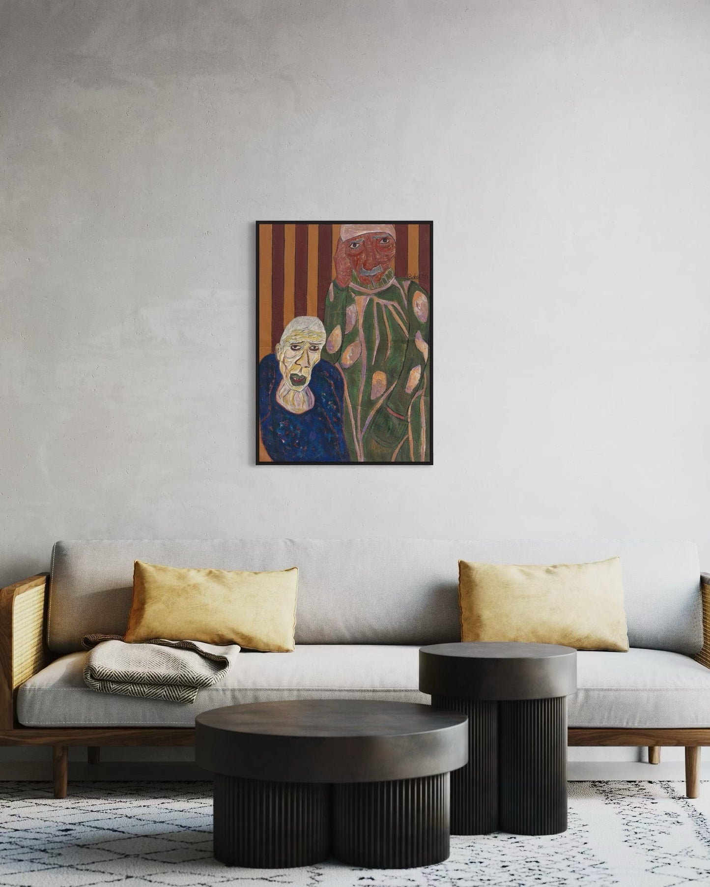 Living room with a gray sofa, gold pillows, and a colorful painting on the wall.