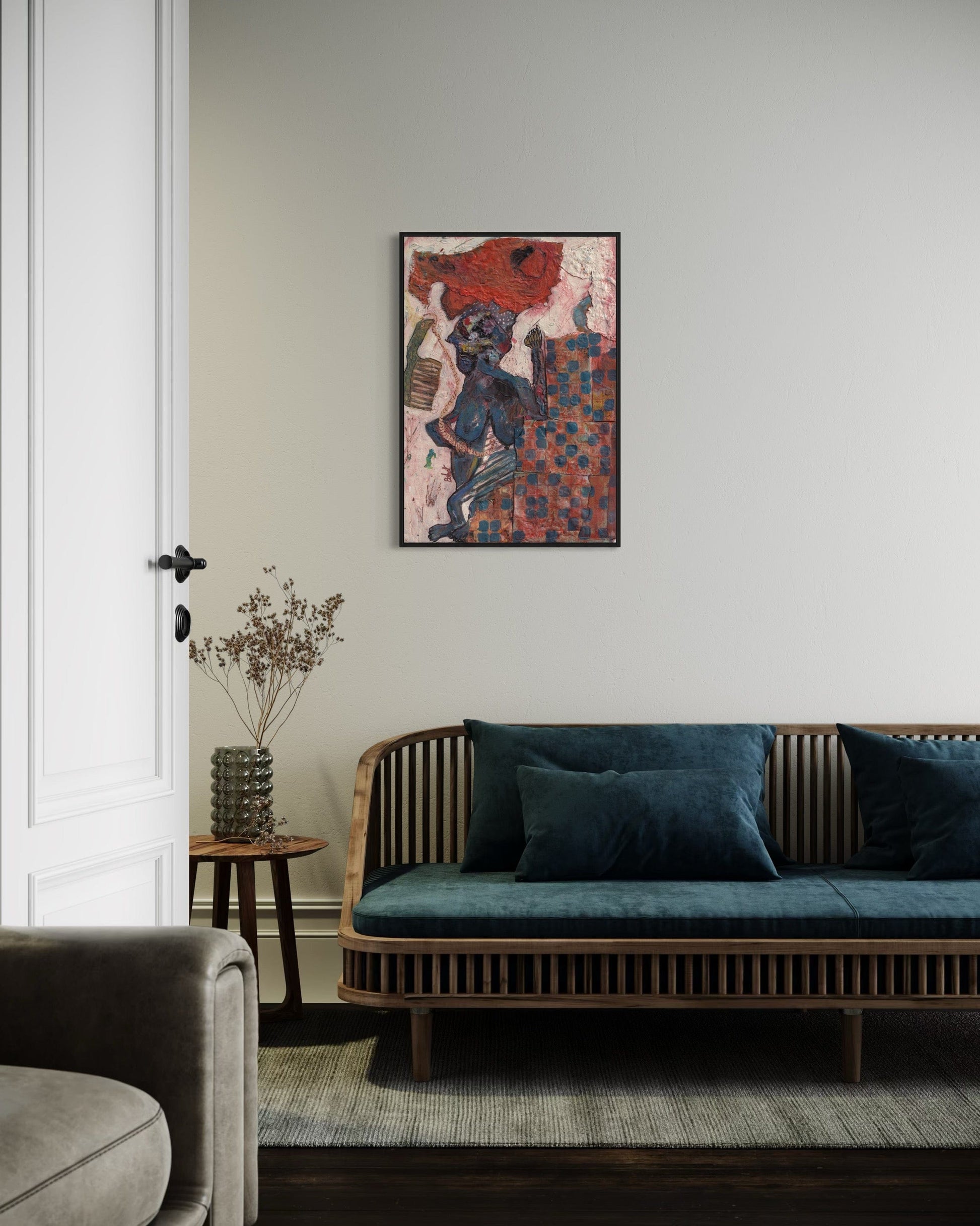 Living room with a wooden sofa, decorative pillows, and a colorful abstract painting on the wall.