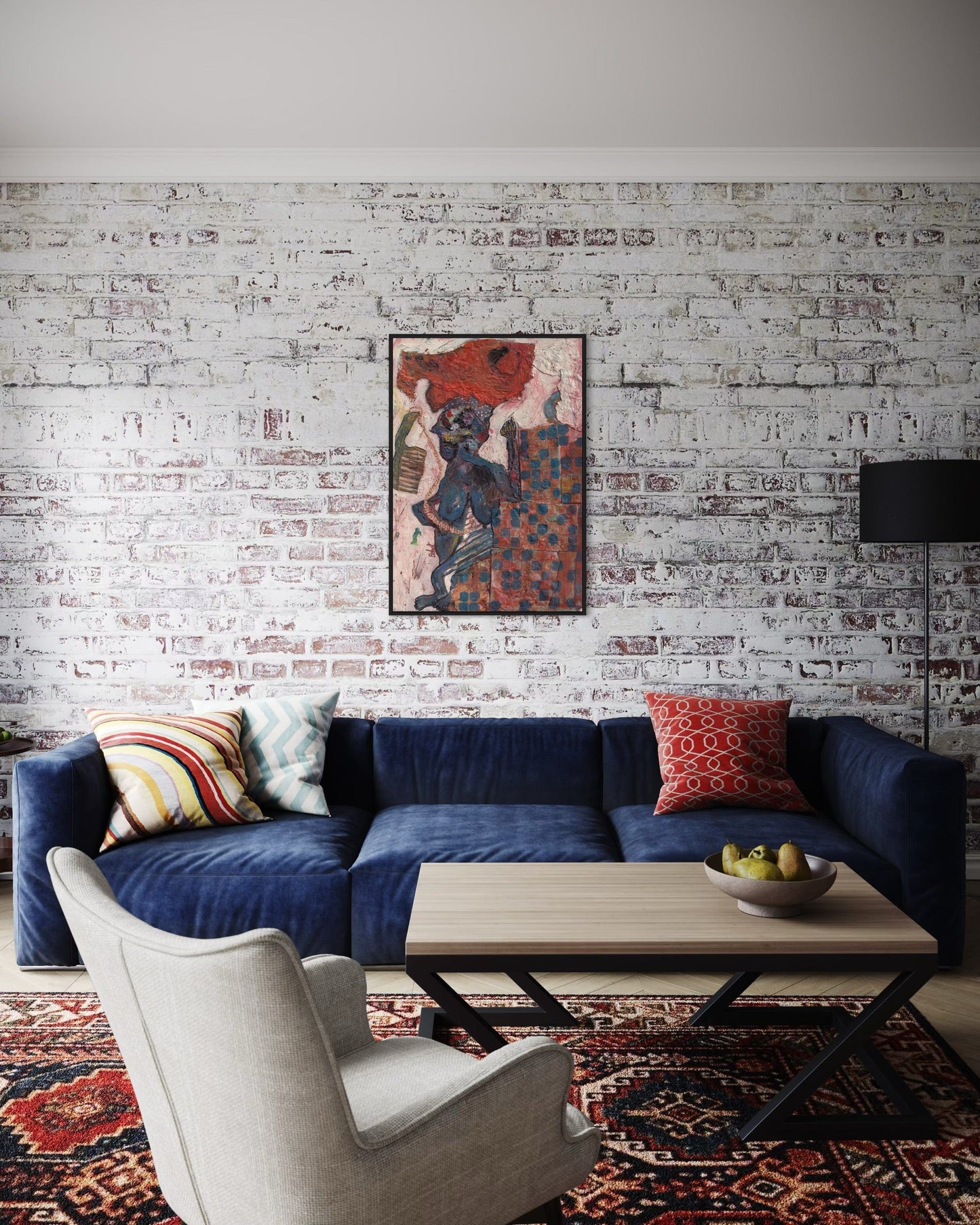 Modern living room with a blue sofa, armchair, and coffee table against a white brick wall.