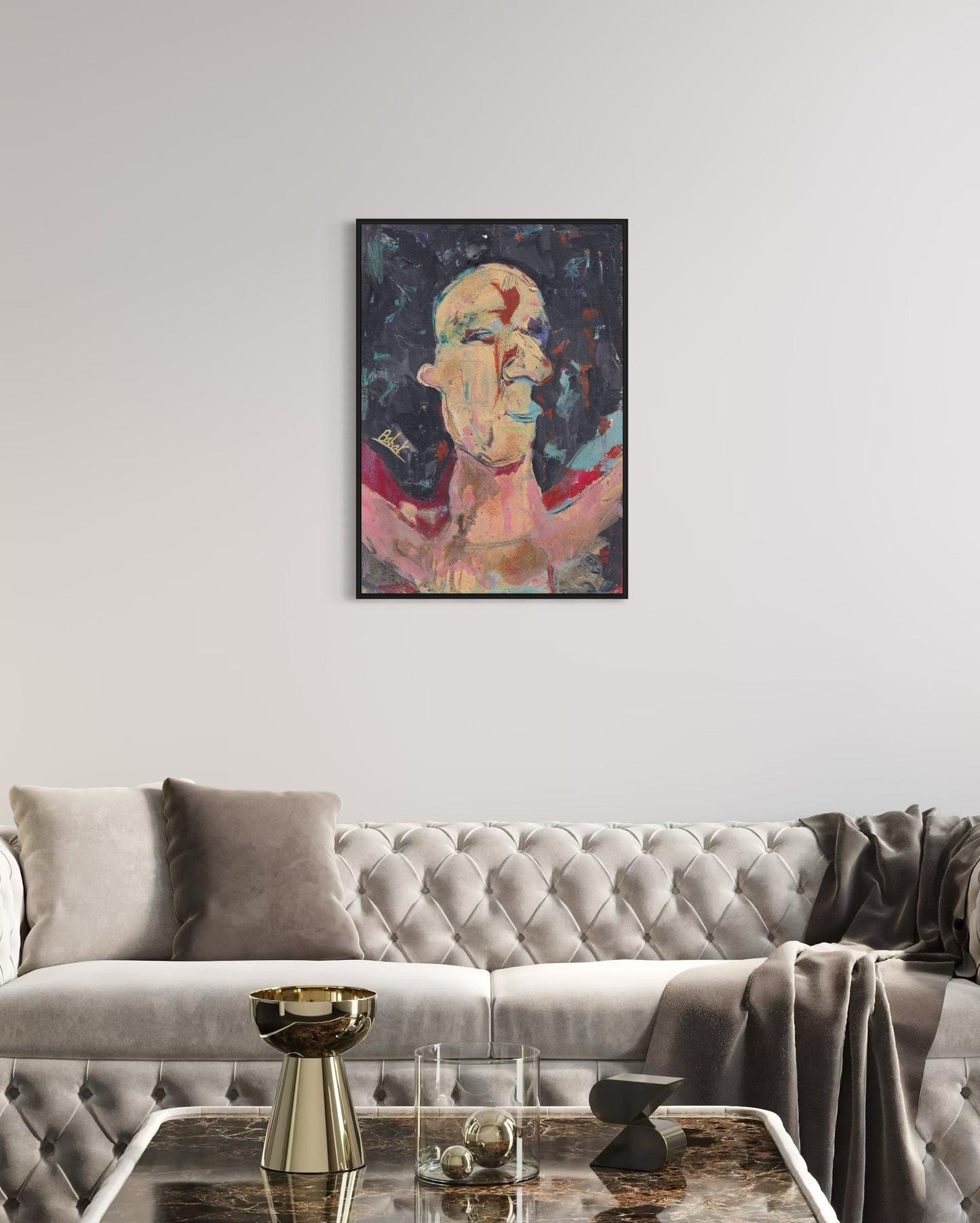 Abstract painting on a wall above a gray sofa in a living room.