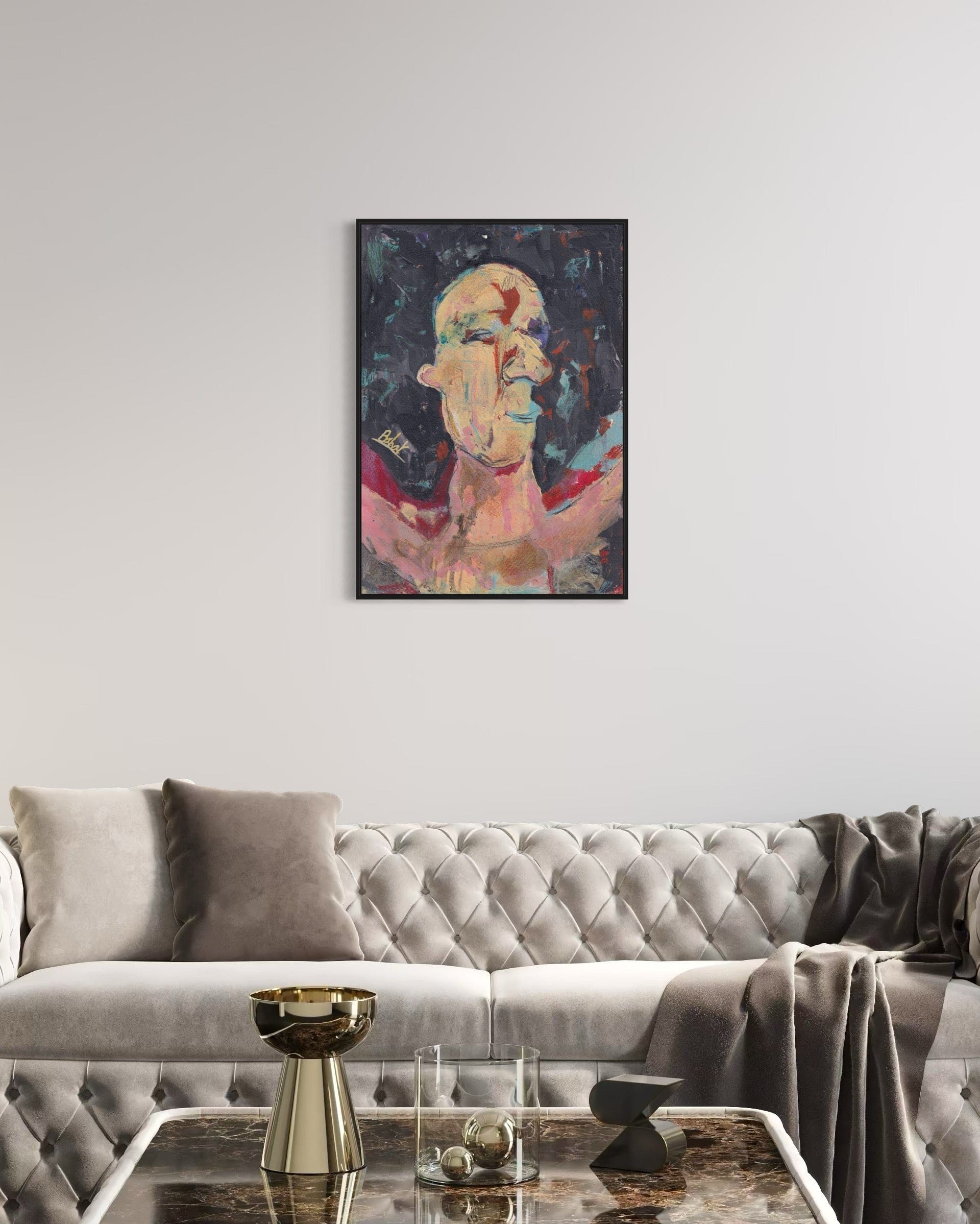 Abstract painting on a wall above a gray sofa in a living room.