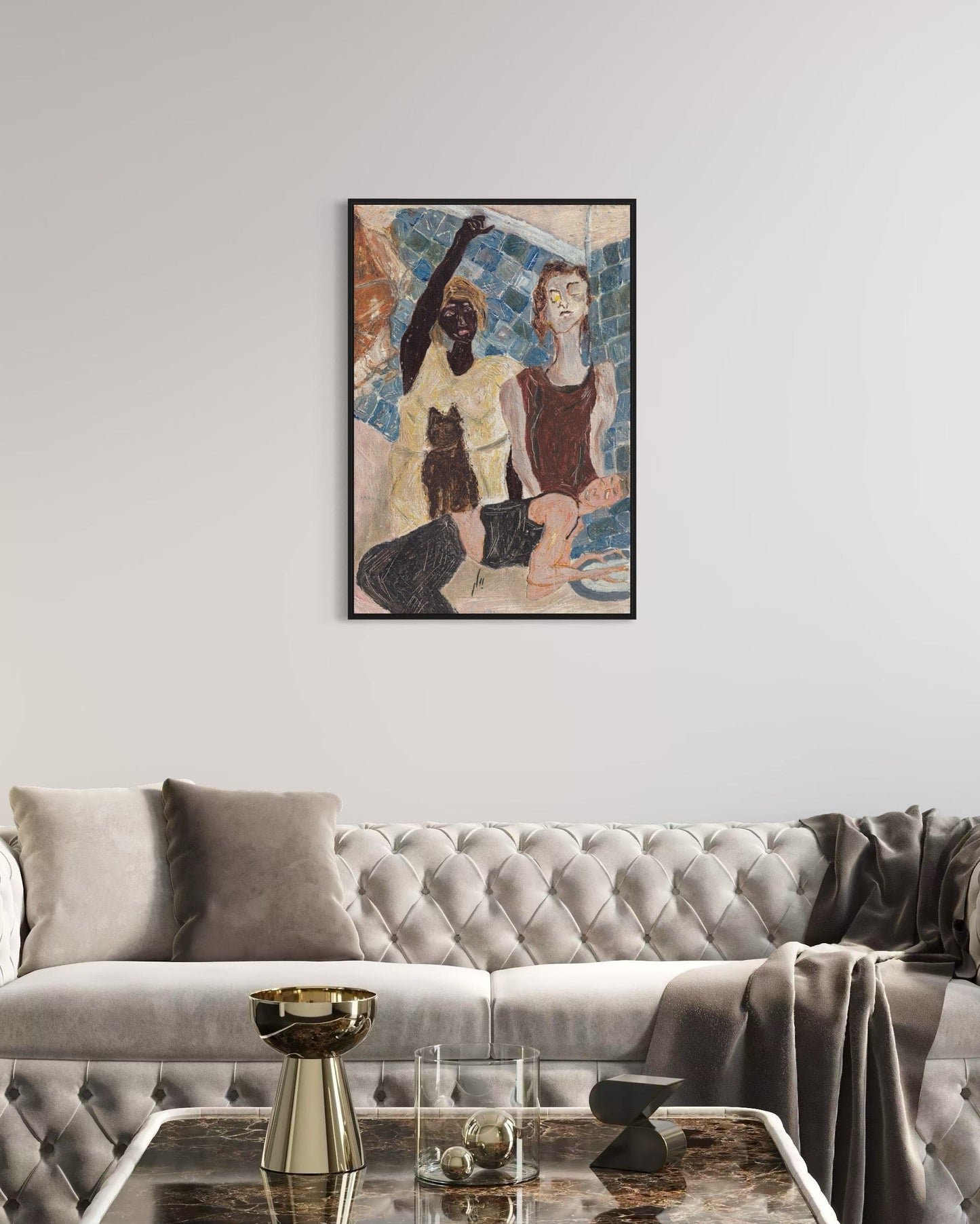 Framed artwork of two figures on a wall above a gray sofa in a living room.