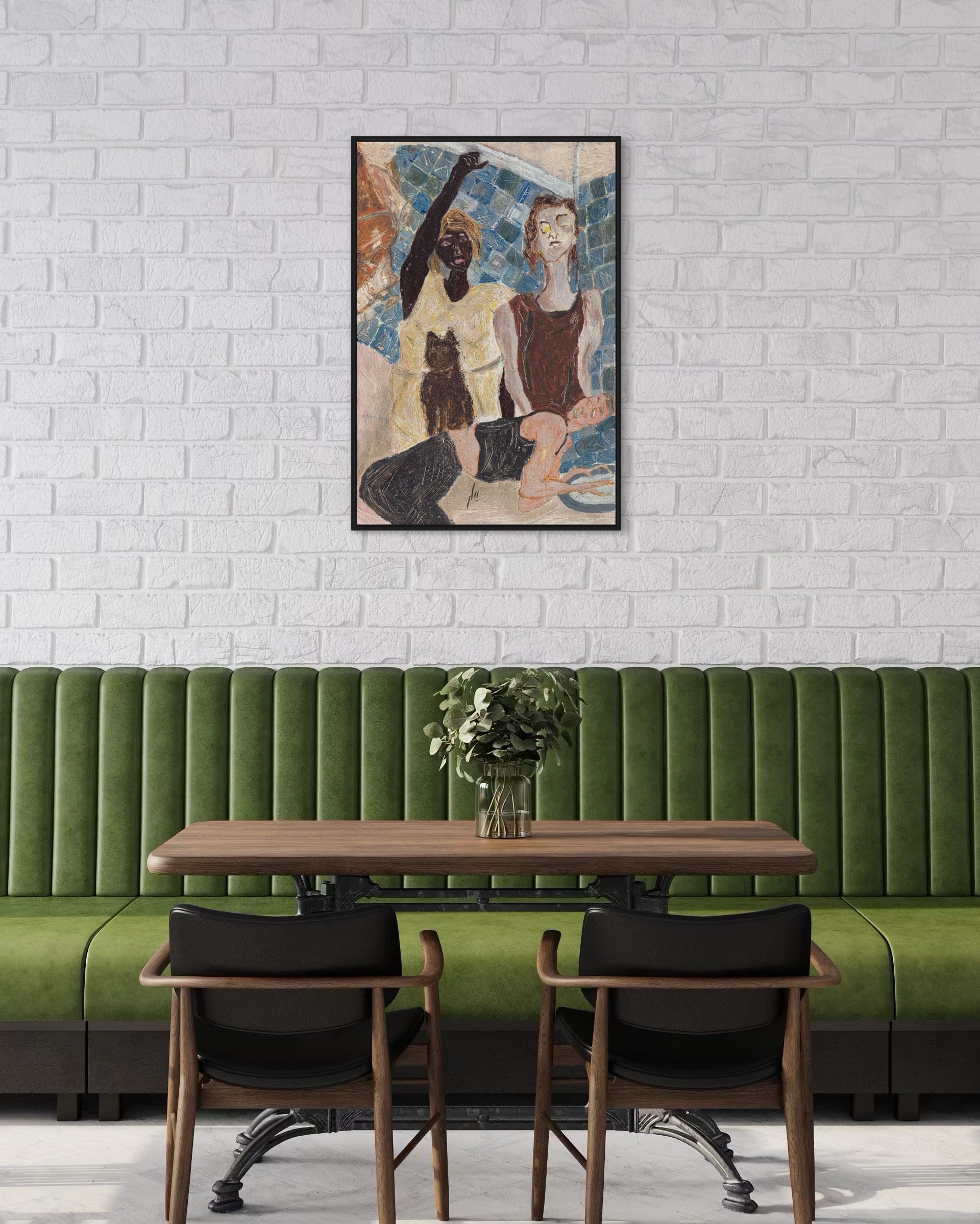 Green booth with wooden table and chairs against a white brick wall with a framed artwork.