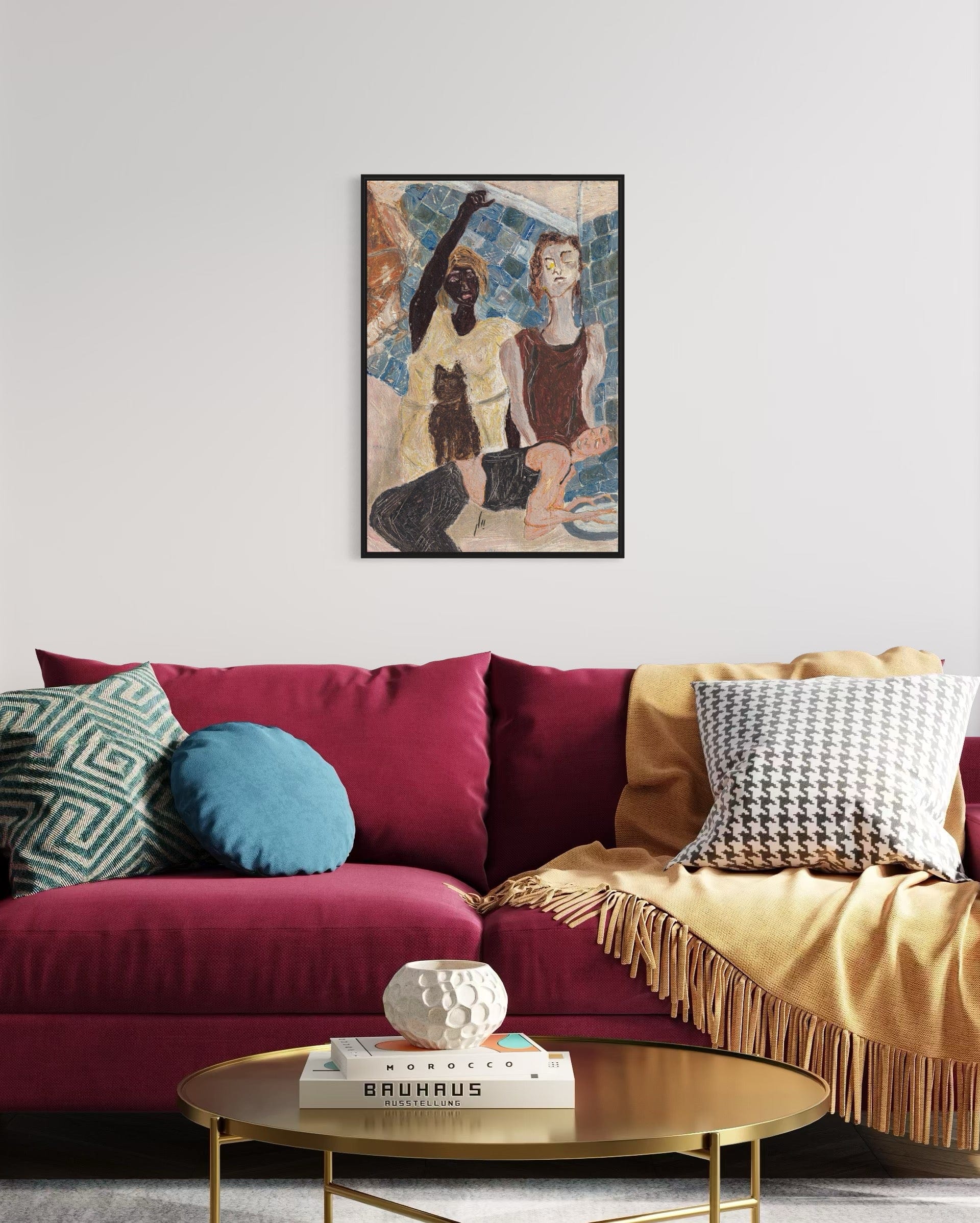 Living room with a colorful sofa, coffee table, and framed artwork on the wall.