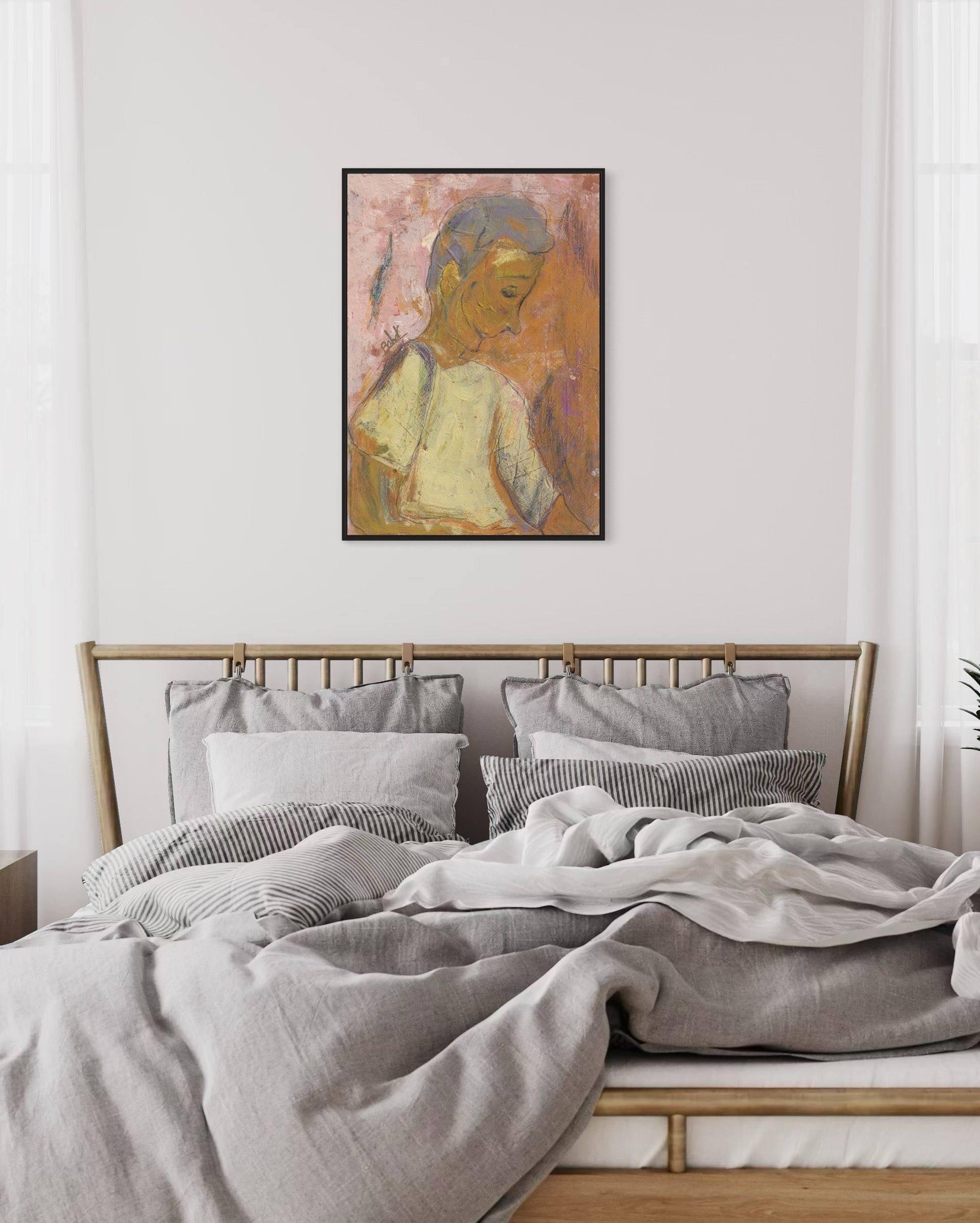 Bedroom with a bed featuring gray bedding and pillows, and a framed artwork on the wall.