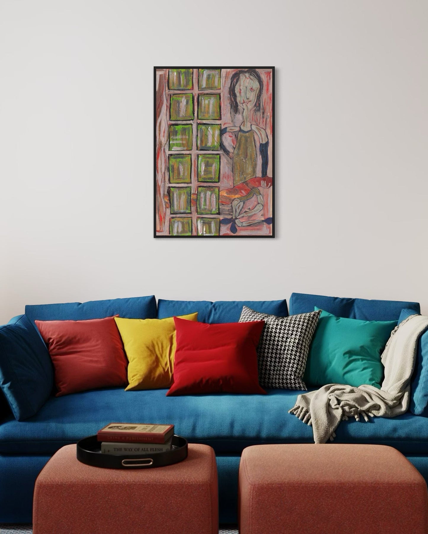 Blue sofa with colorful pillows and a painting on the wall in a living room.