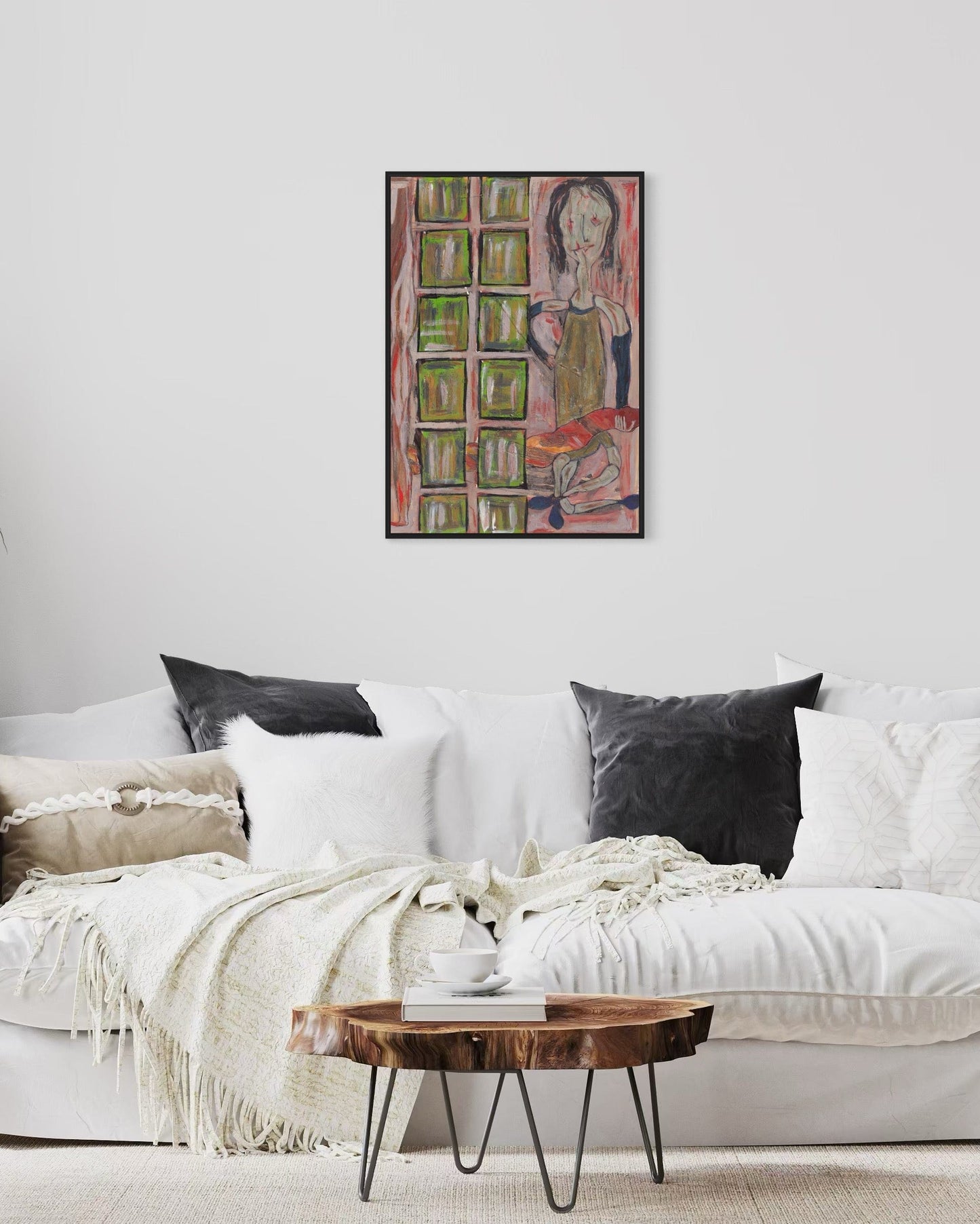 Living room with a white sofa, wooden coffee table, and colorful abstract painting on the wall.