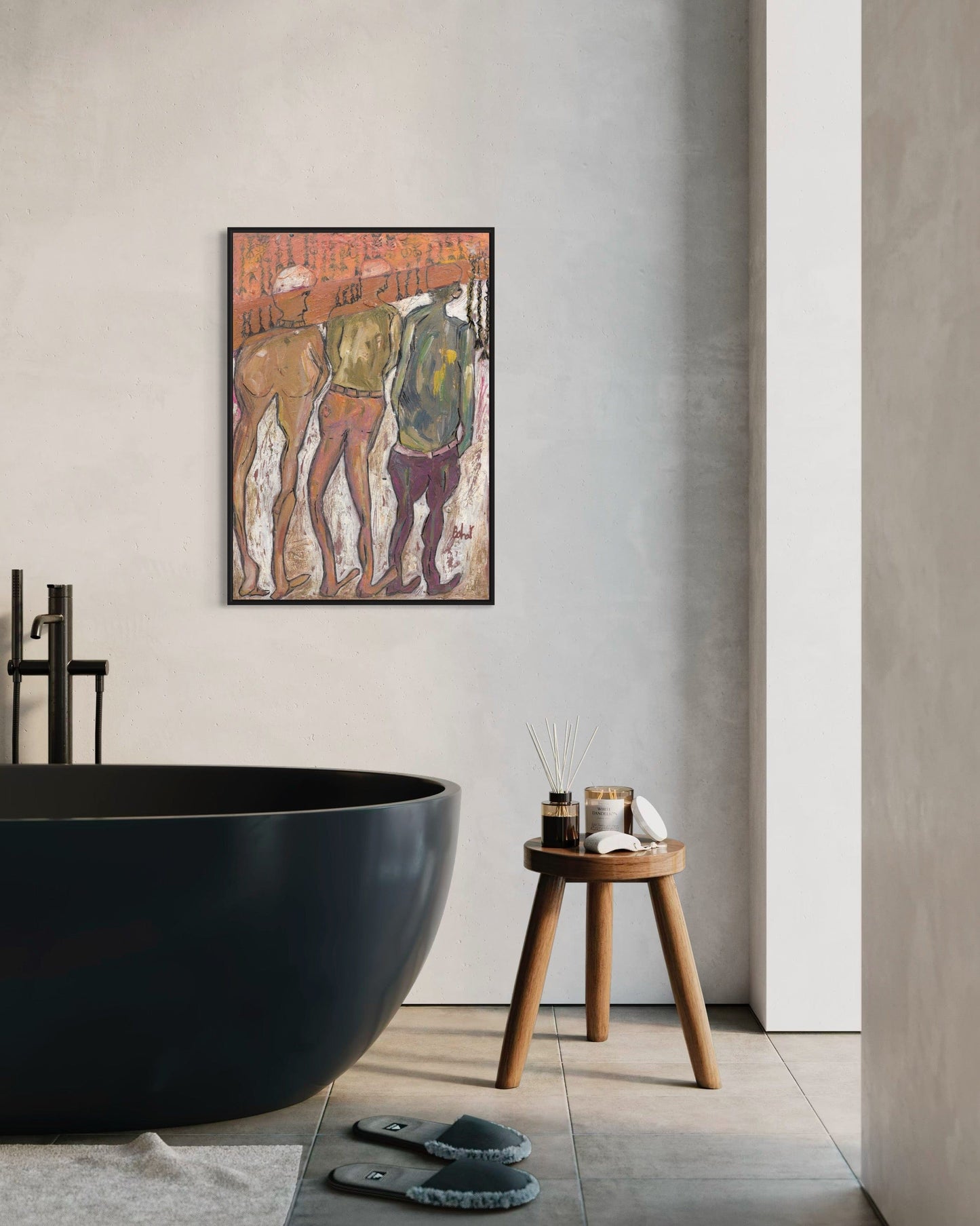 Bathroom interior with a black freestanding bathtub, wooden stool, and abstract art on the wall.