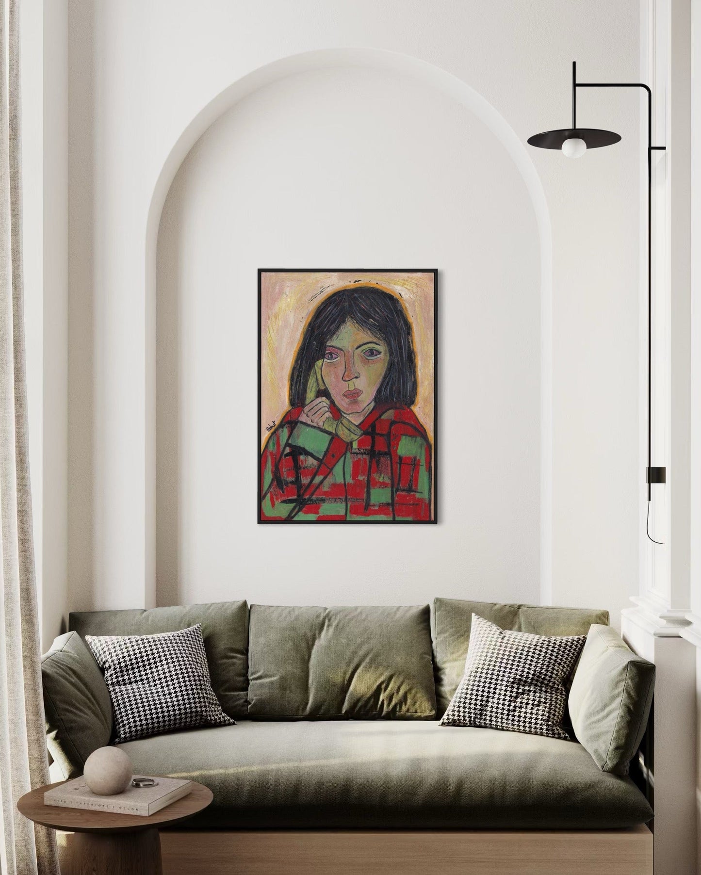 Sofa with a painting of a woman on the wall in a modern living room.
