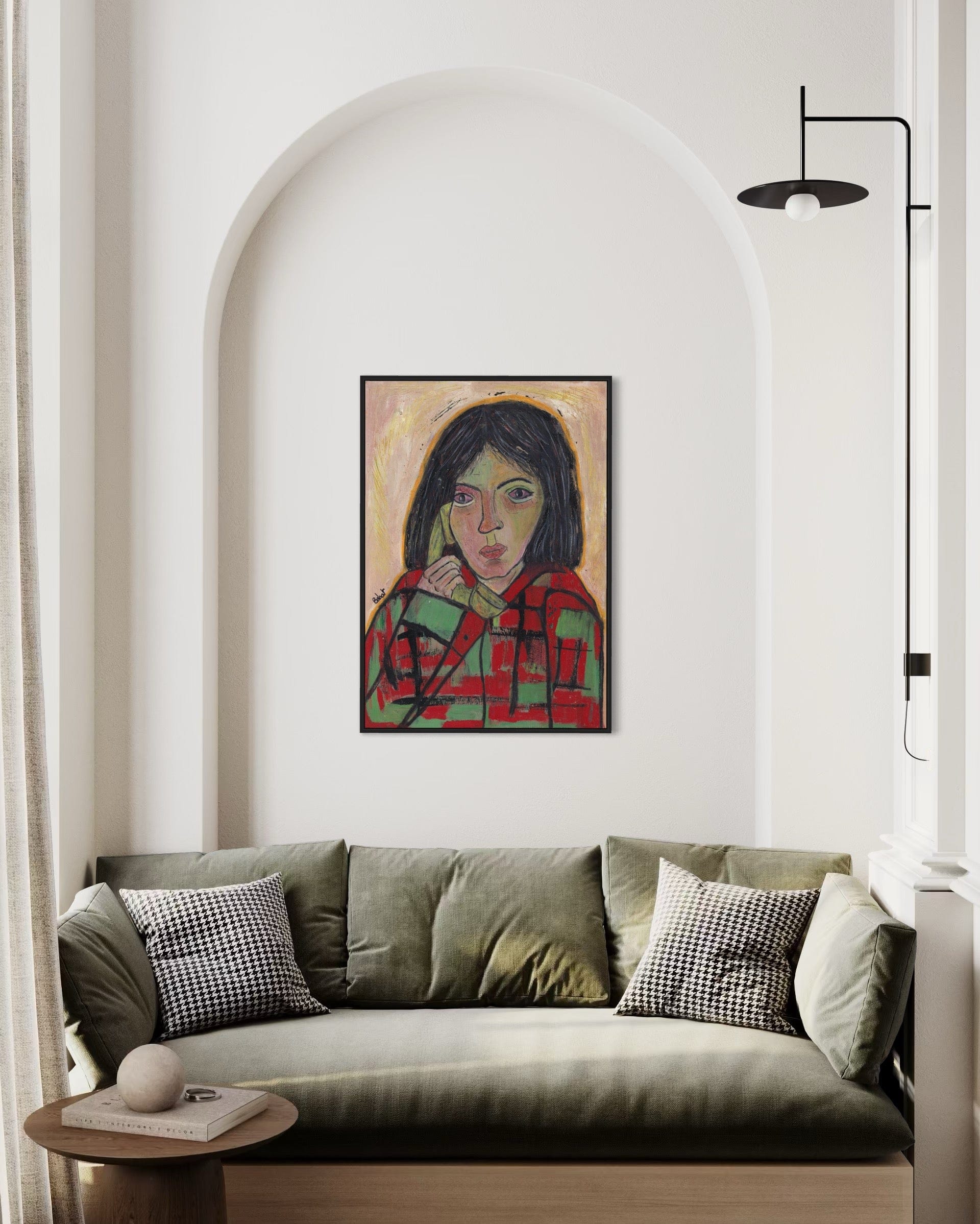 Sofa with a painting of a woman on the wall in a modern living room.