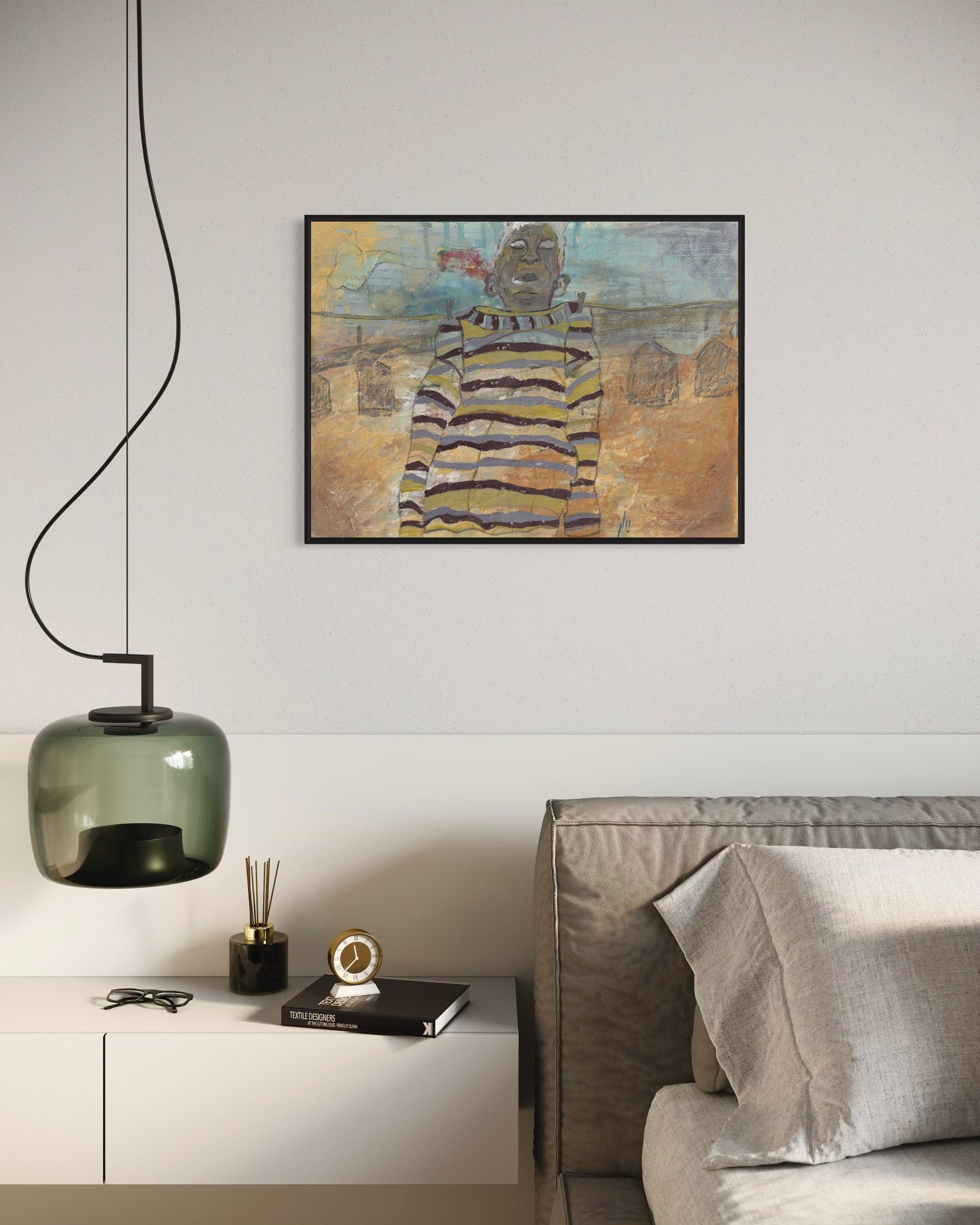 Modern living room with abstract painting, pendant light, and sofa.