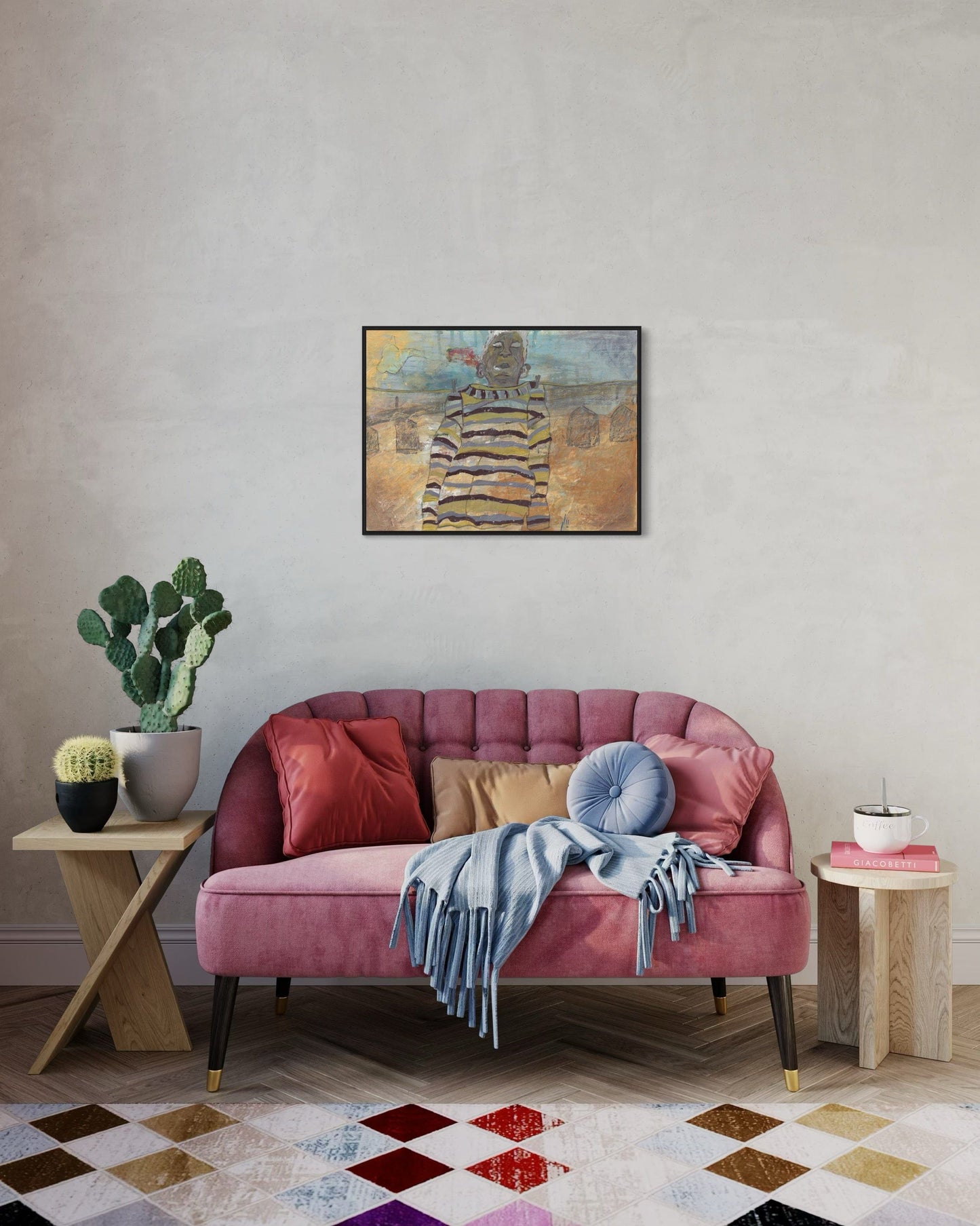 Pink sofa with colorful cushions in a living room setting with a painting on the wall.