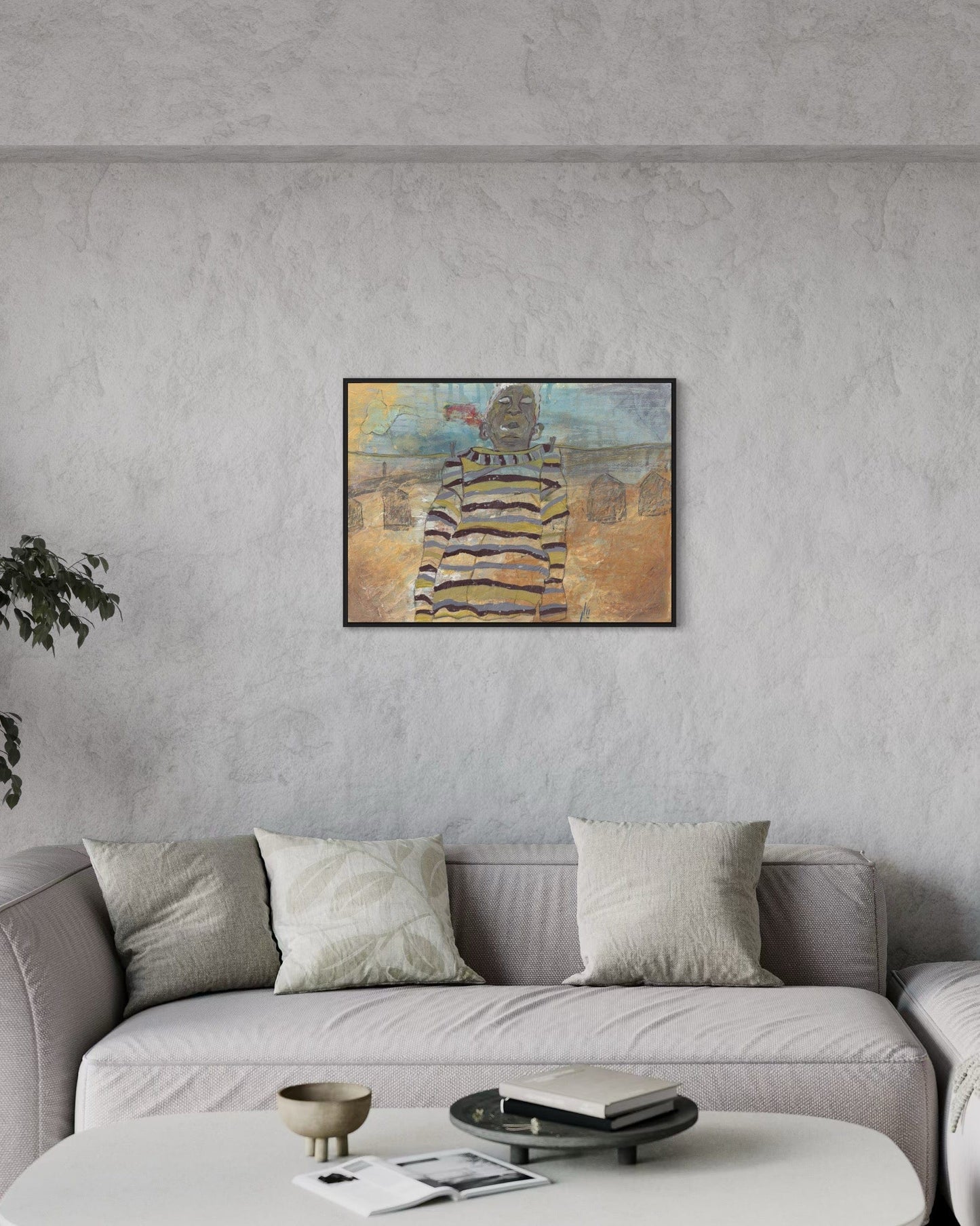 Abstract painting on a gray wall above a gray sofa in a living room.