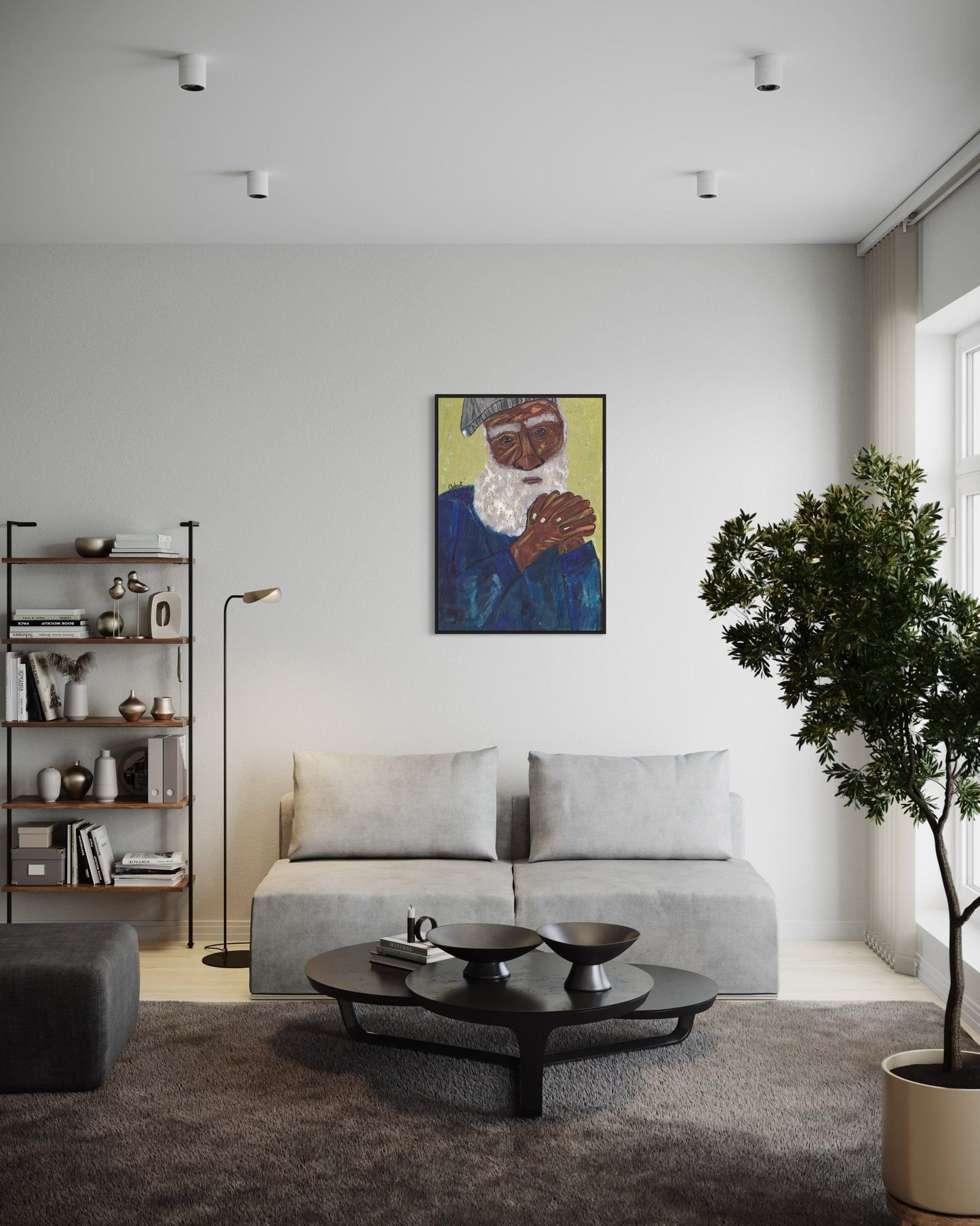 Modern living room with a gray sofa, coffee table, and wall art.
