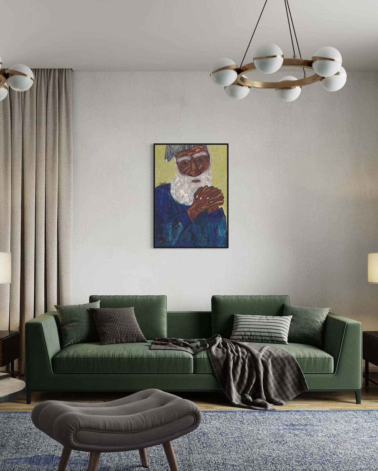 Living room with a green sofa, gray ottoman, and framed artwork on the wall.