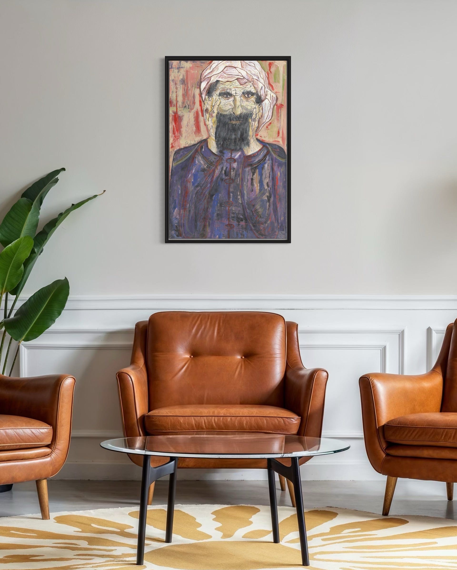 Living room with brown leather chairs, a glass coffee table, and a framed portrait on the wall.