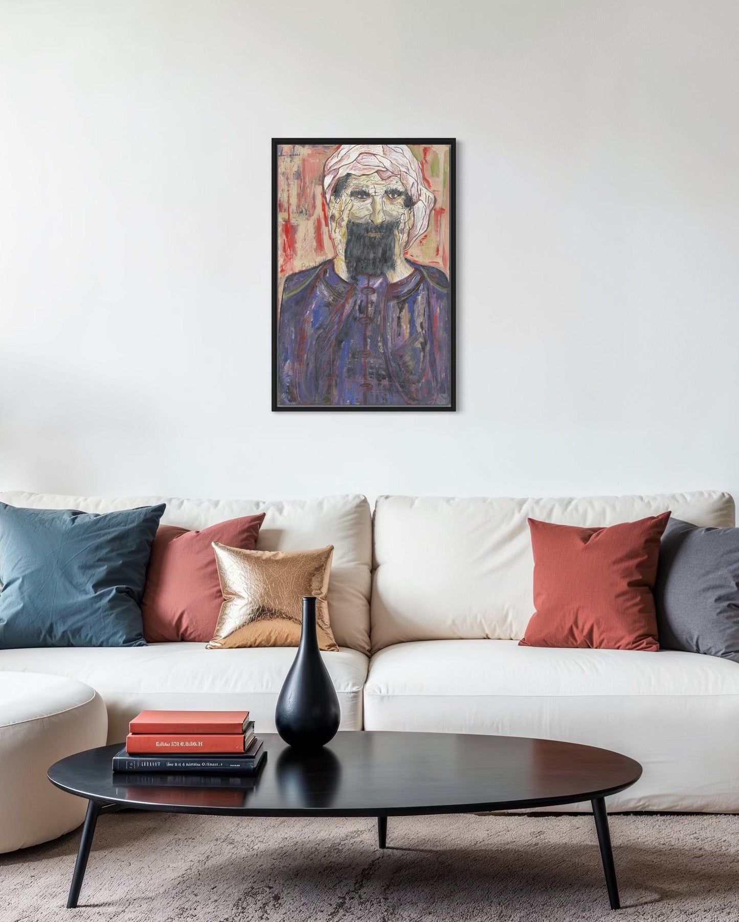 Living room with a white sofa, colorful pillows, a black coffee table, and a framed portrait on the wall.
