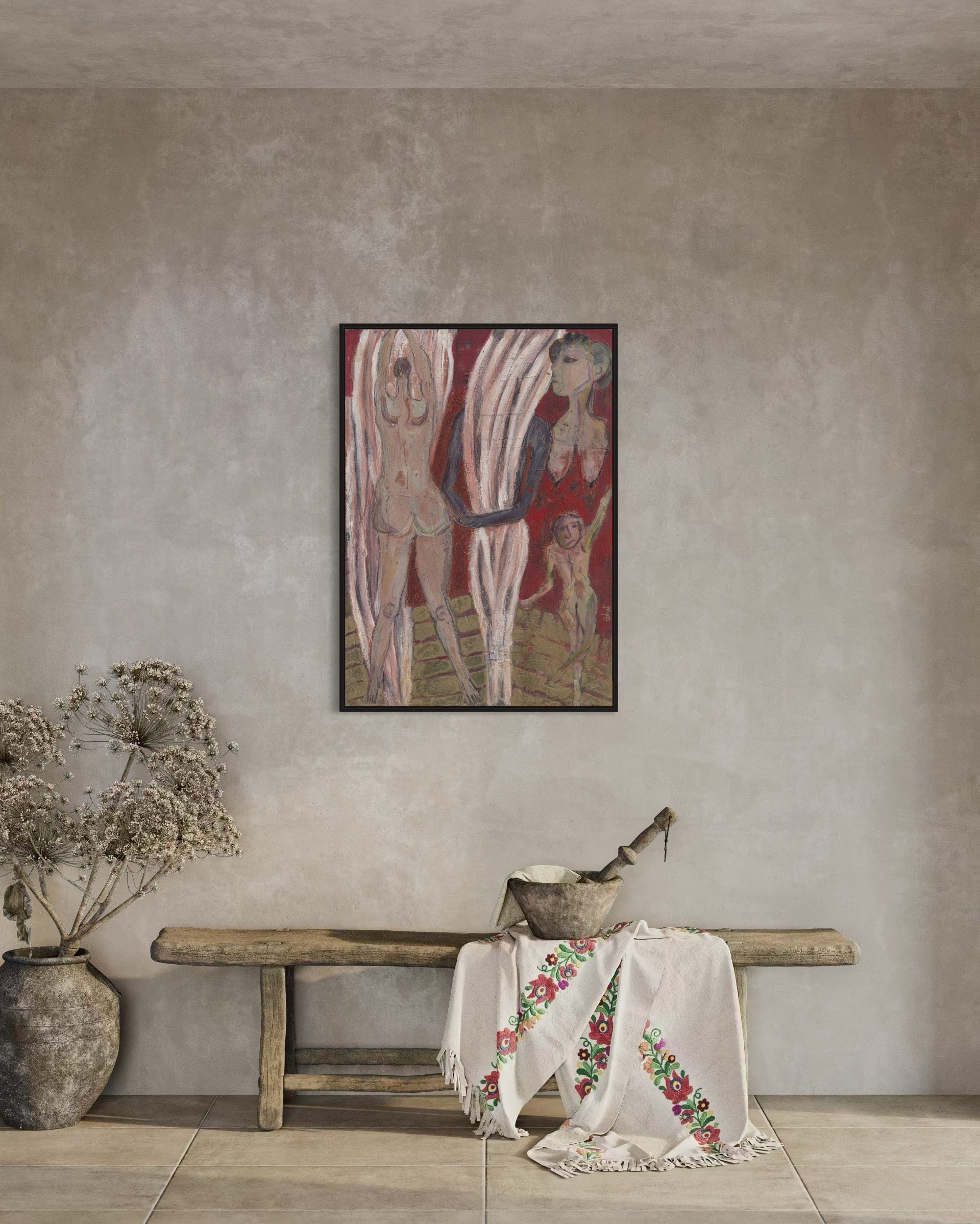 Artistic depiction of a woman with a child on a textured wall above a wooden bench with a floral cloth.