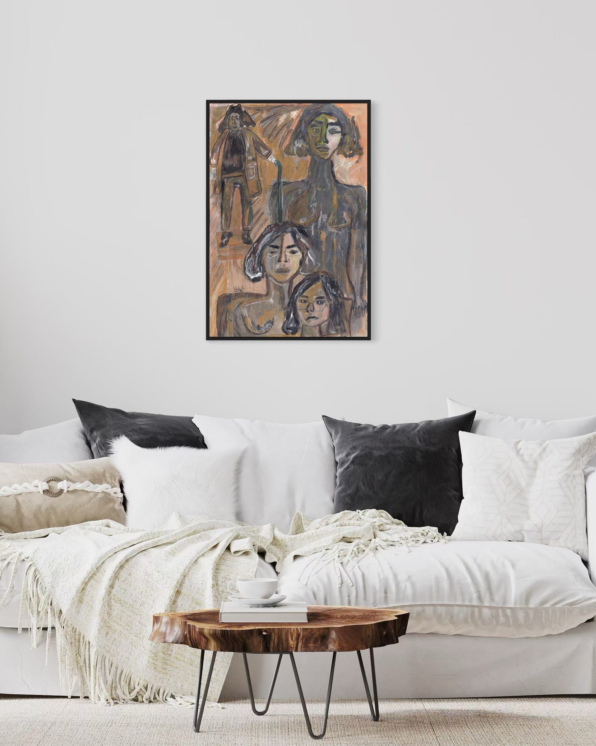 Living room with a white sofa, wooden coffee table, and abstract art on the wall.