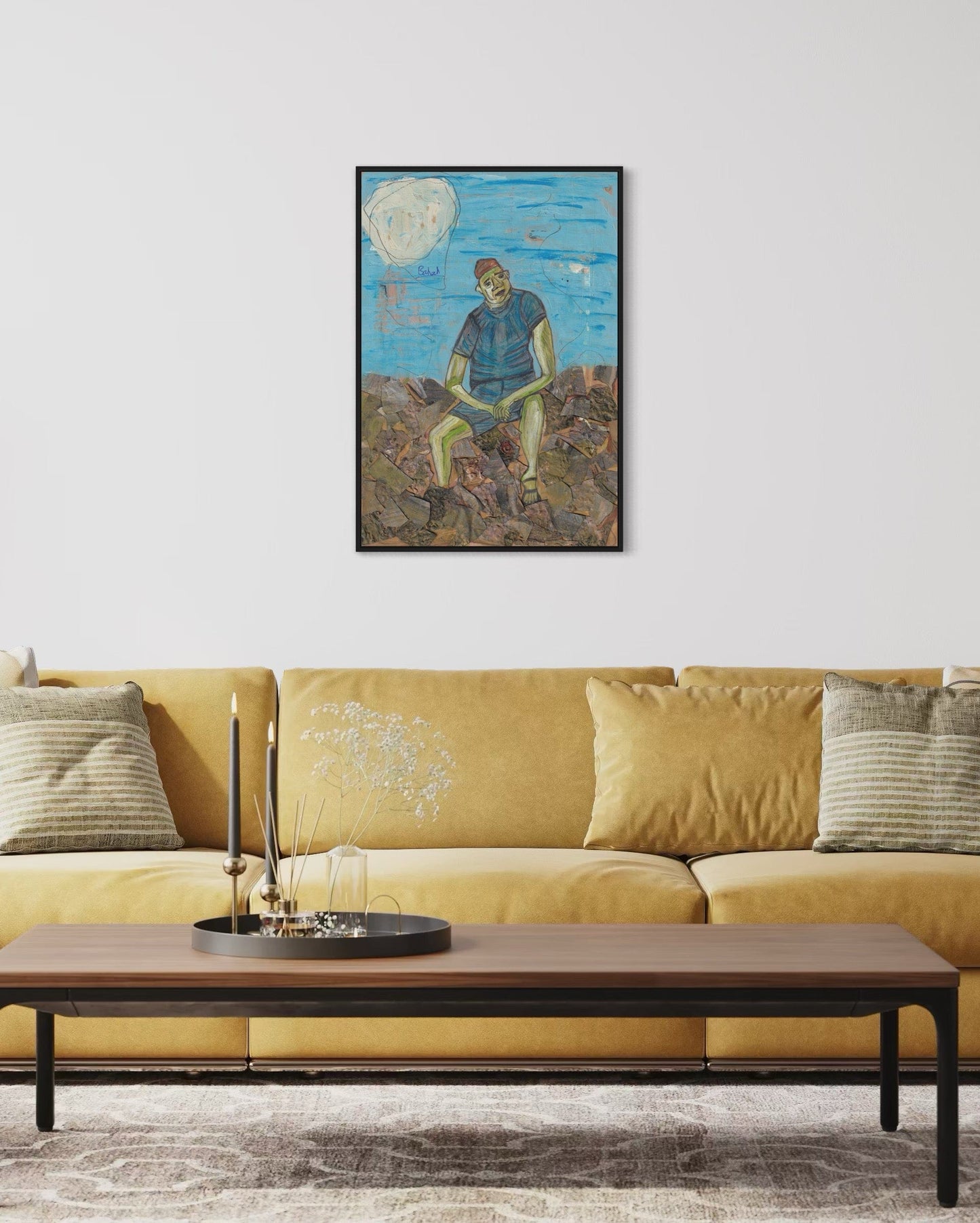 Framed artwork above a yellow sofa in a living room setting