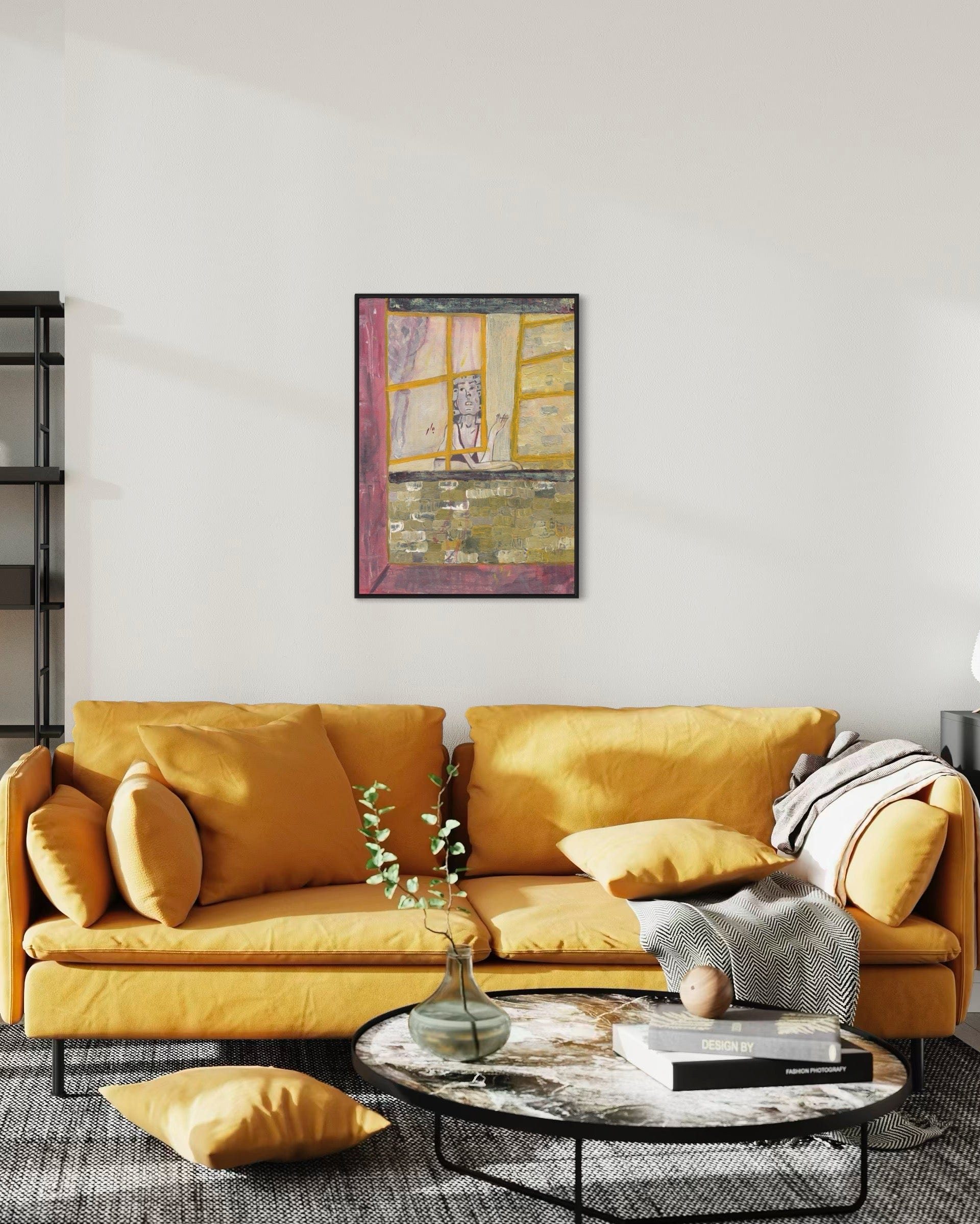 Yellow sofa in a living room with a painting on the wall and a coffee table with decor items.