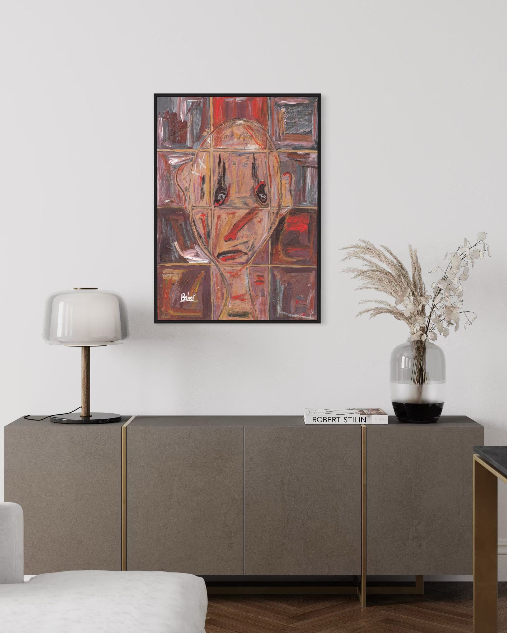 Modern living room with a sideboard, lamp, and abstract painting on the wall.