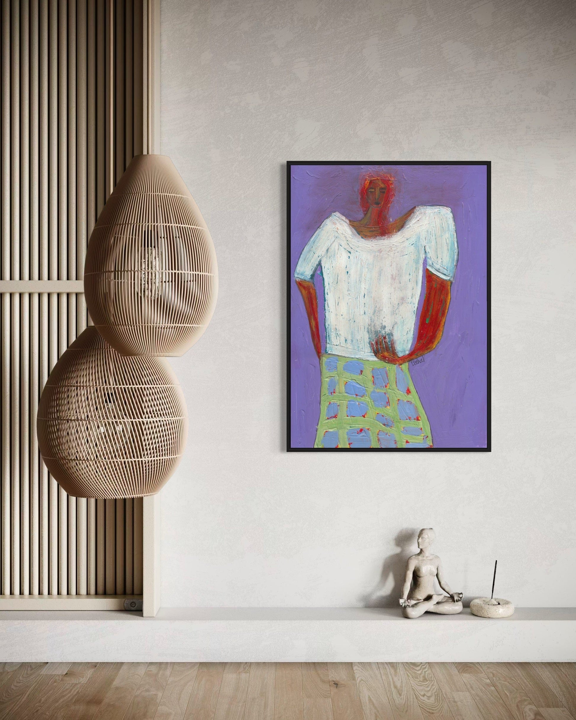 Modern interior with a colorful abstract painting of a person on a purple background, a woven chair, and a small statue.