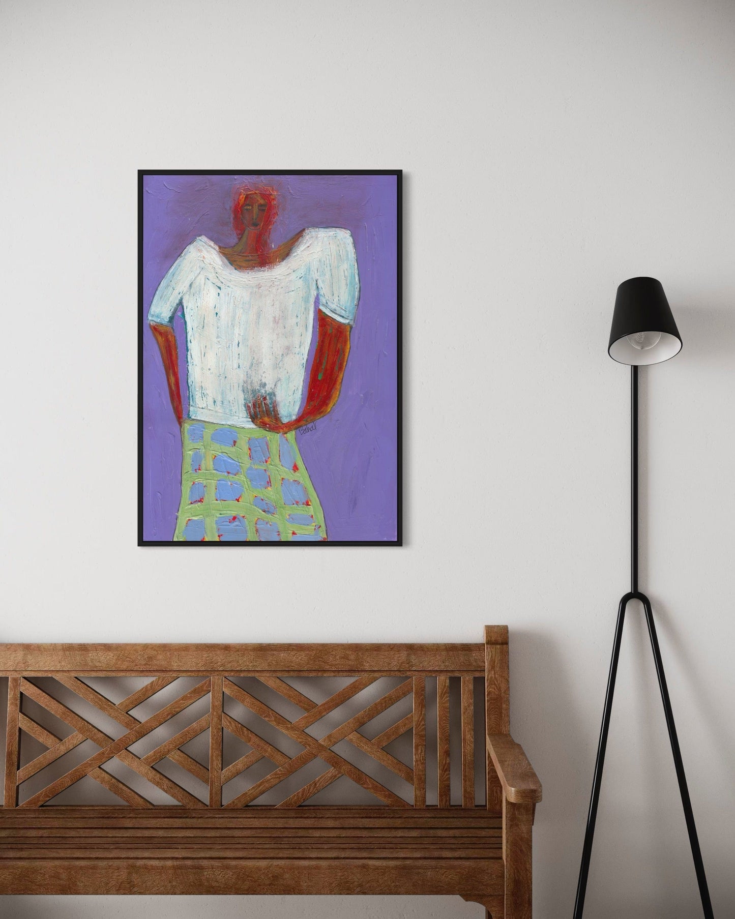 Framed artwork of a person with a purple background, wooden bench, and black floor lamp.