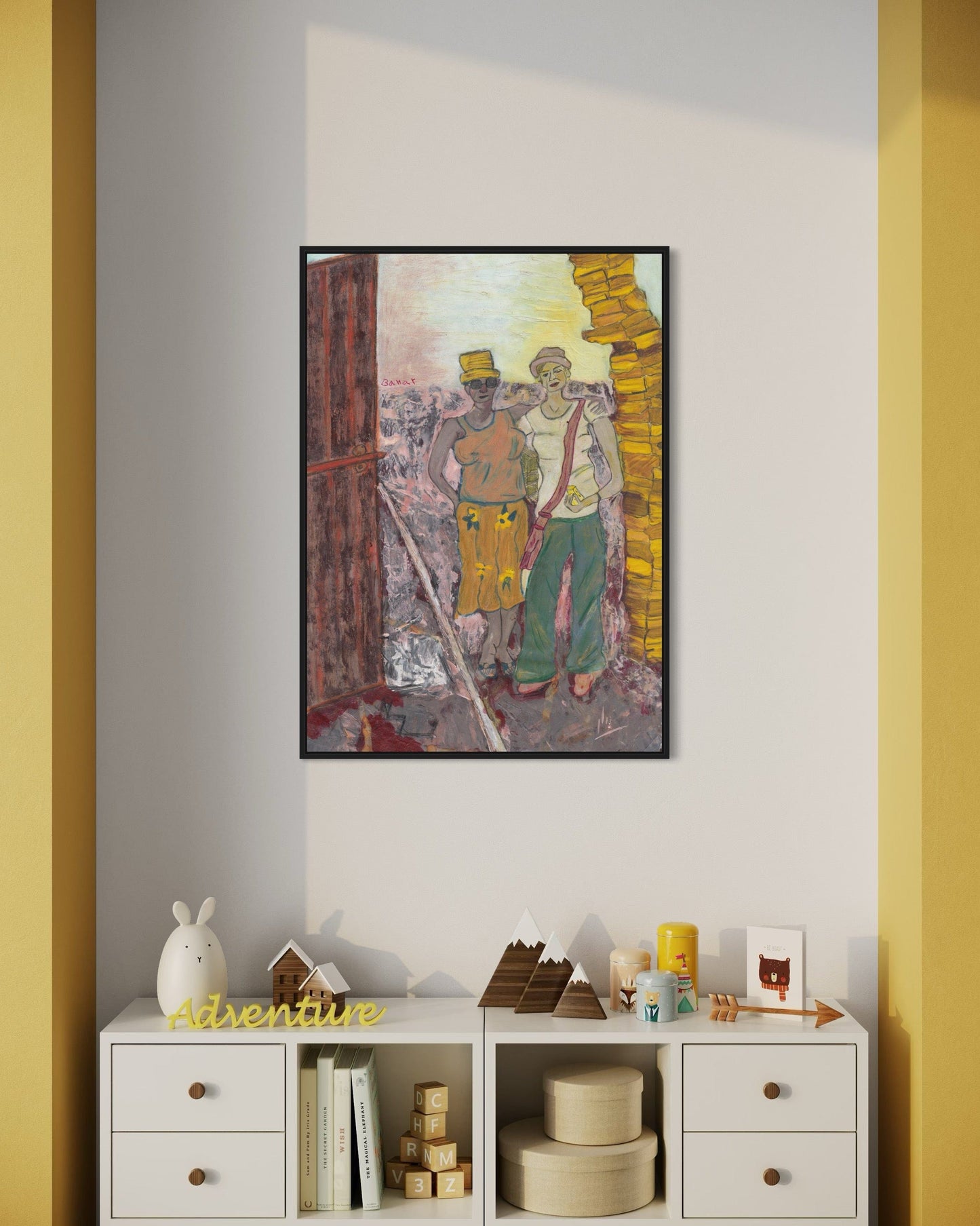 Framed artwork of two figures on a wall with a white shelf below