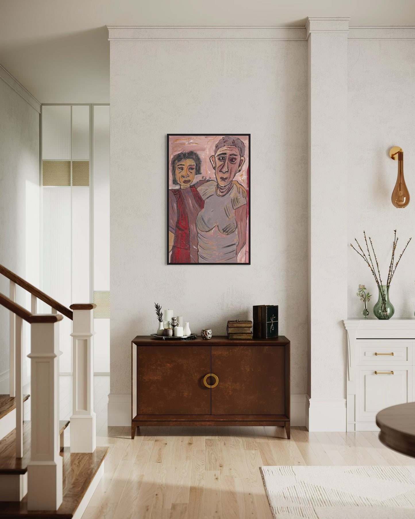 Living room with a wooden sideboard, framed artwork, and decorative items.