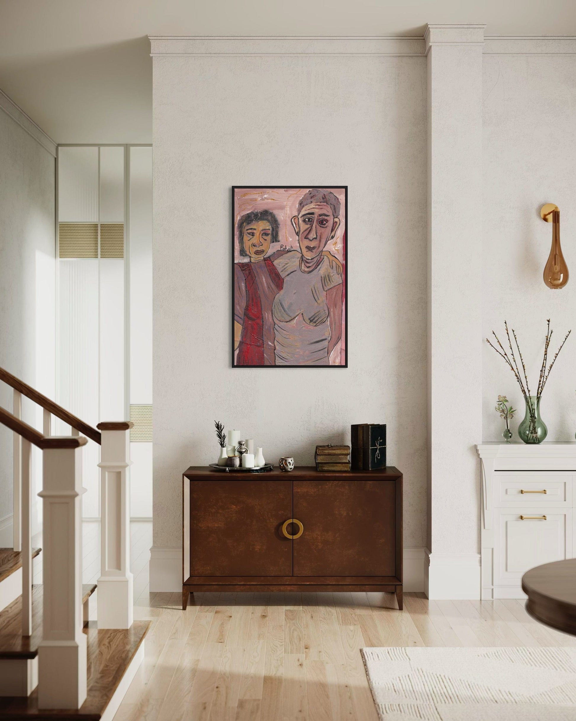 Living room with a wooden sideboard, framed artwork, and decorative items.