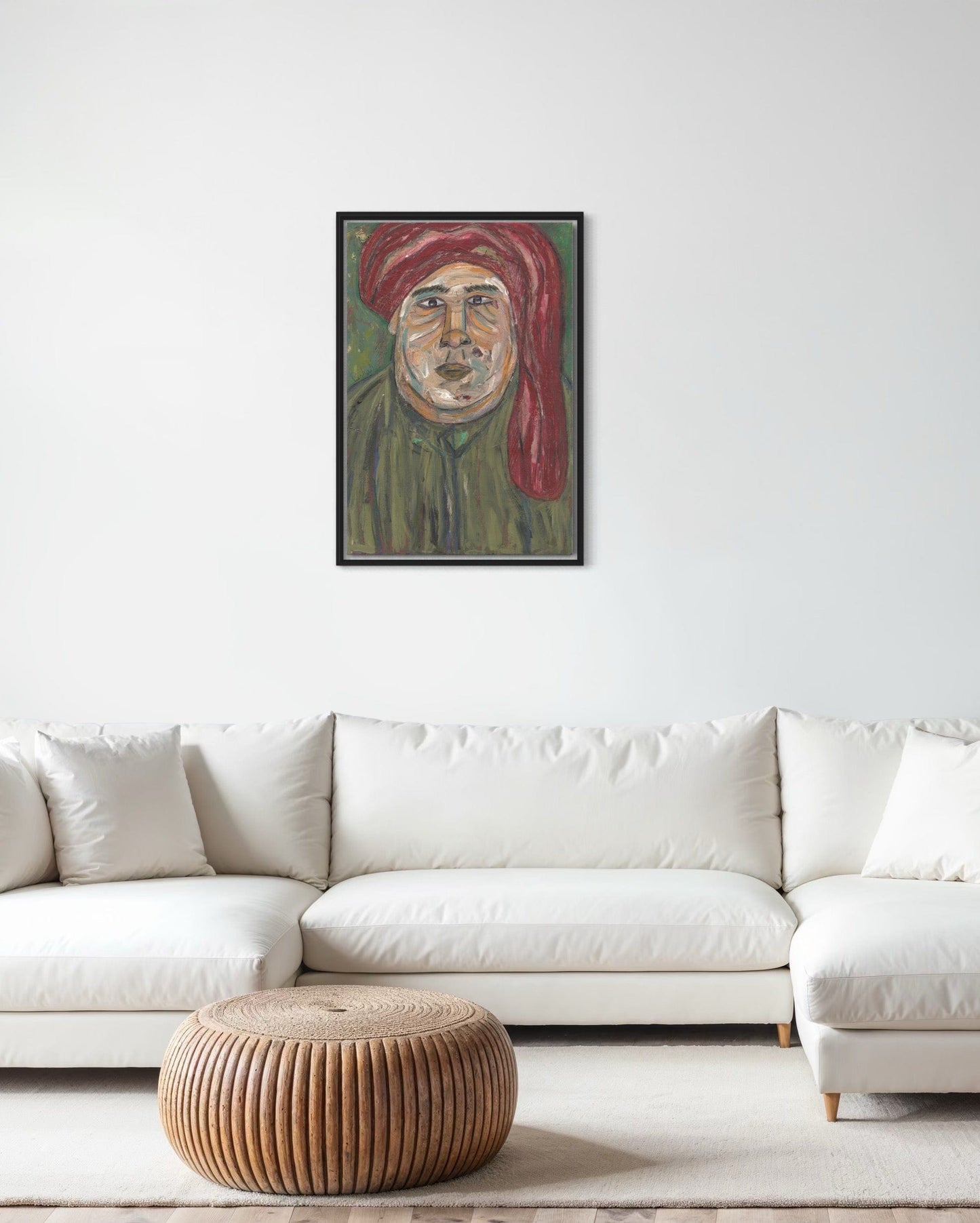 Framed portrait above a white sofa in a living room