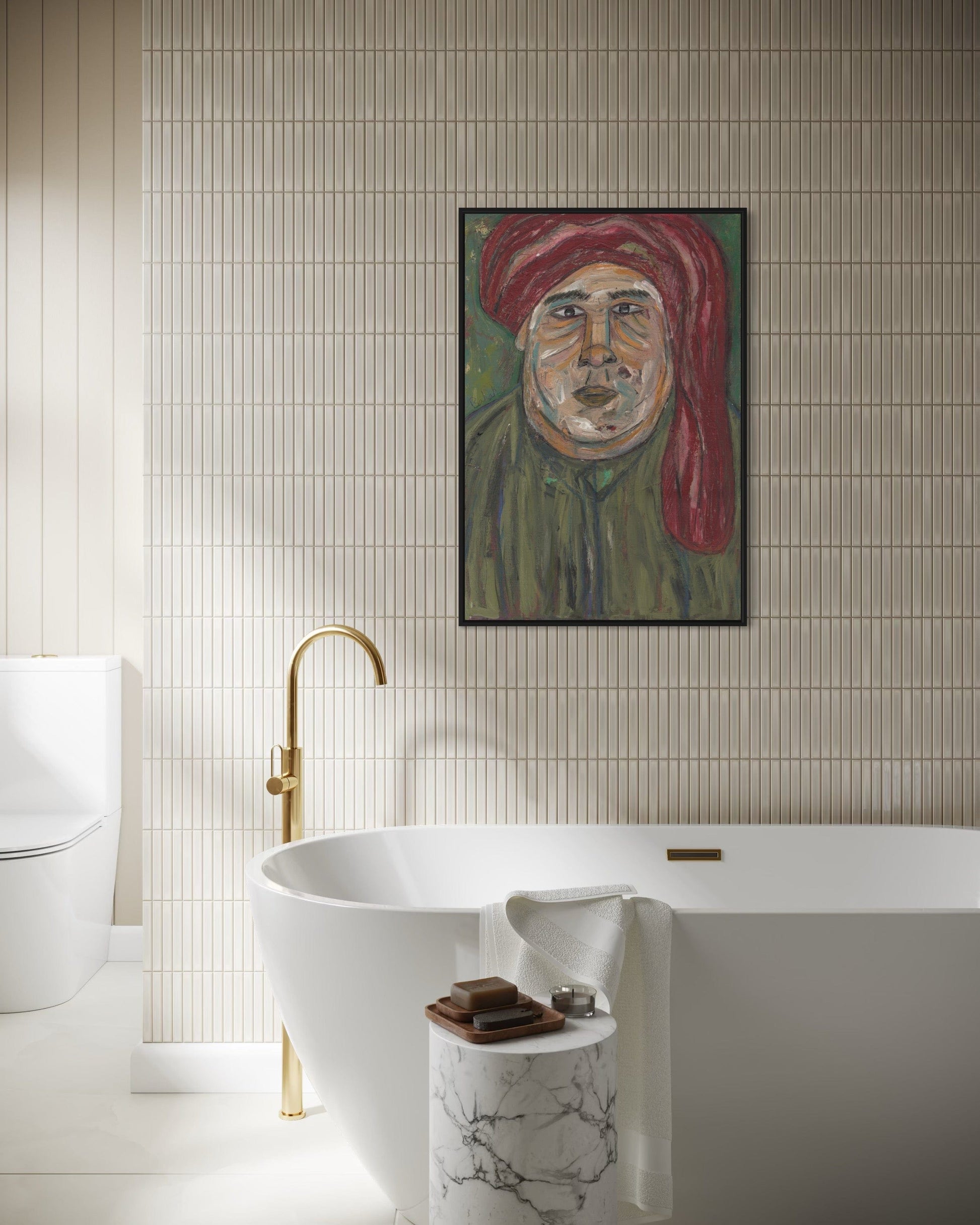 Bathroom interior with a freestanding bathtub, gold faucet, and wall art of a man with a red turban.