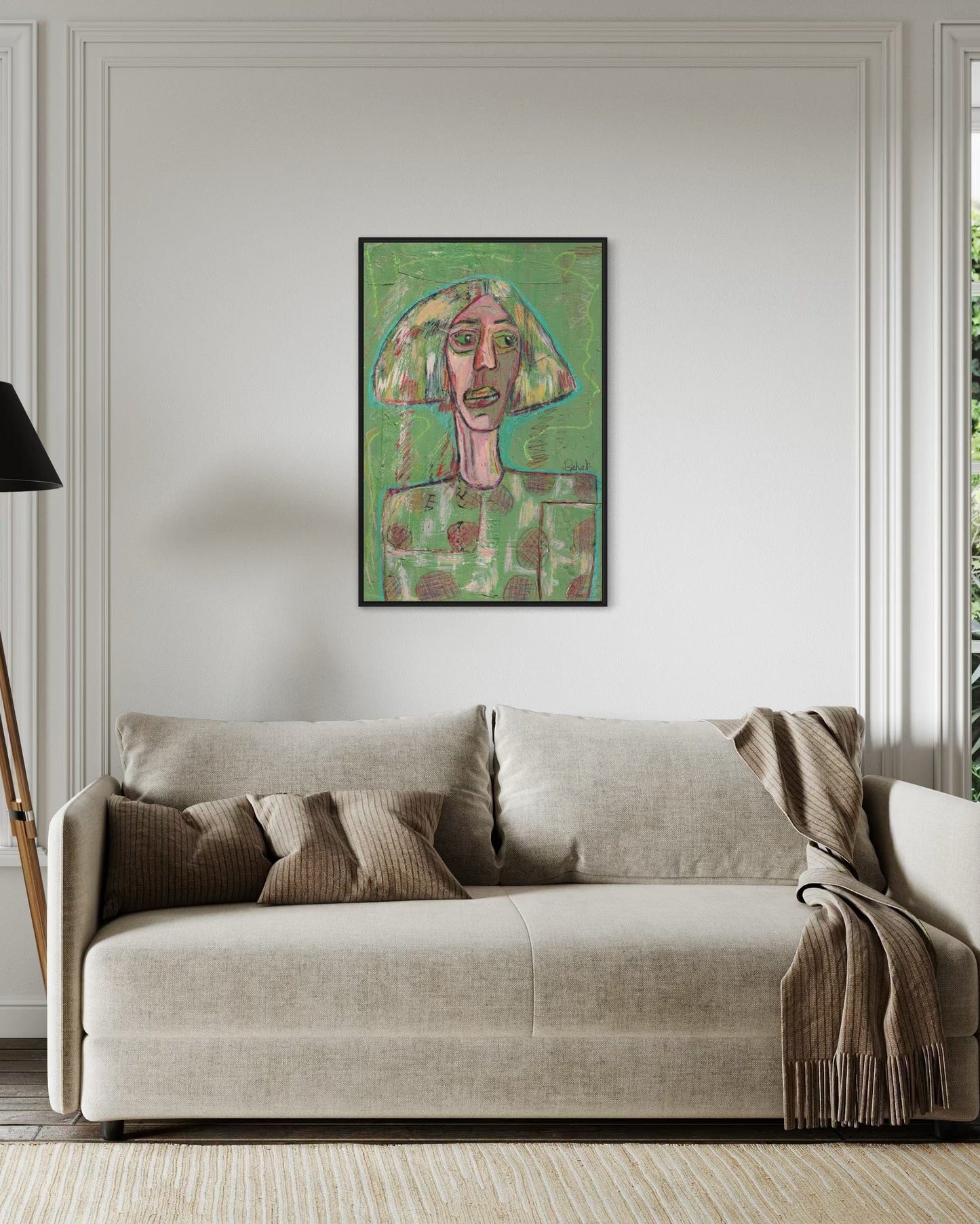 Living room with a beige sofa and a colorful abstract painting on the wall.