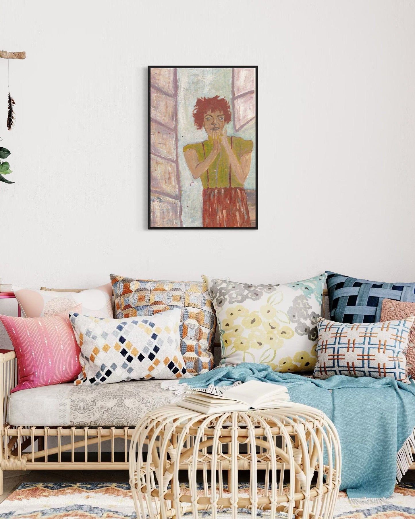 Living room with a sofa, cushions, and a framed artwork on the wall.