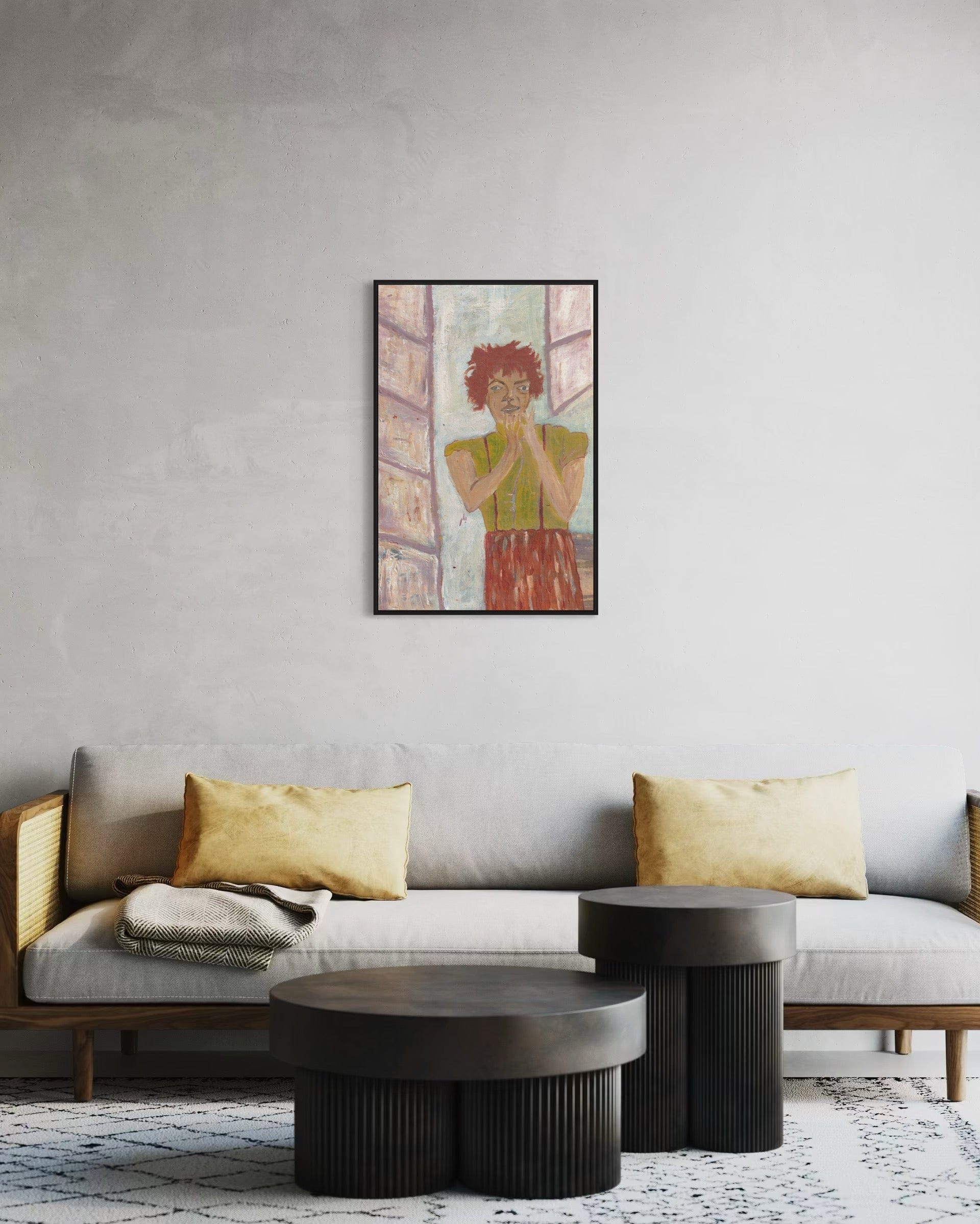 Living room with a gray sofa, gold pillows, and a framed artwork on the wall.