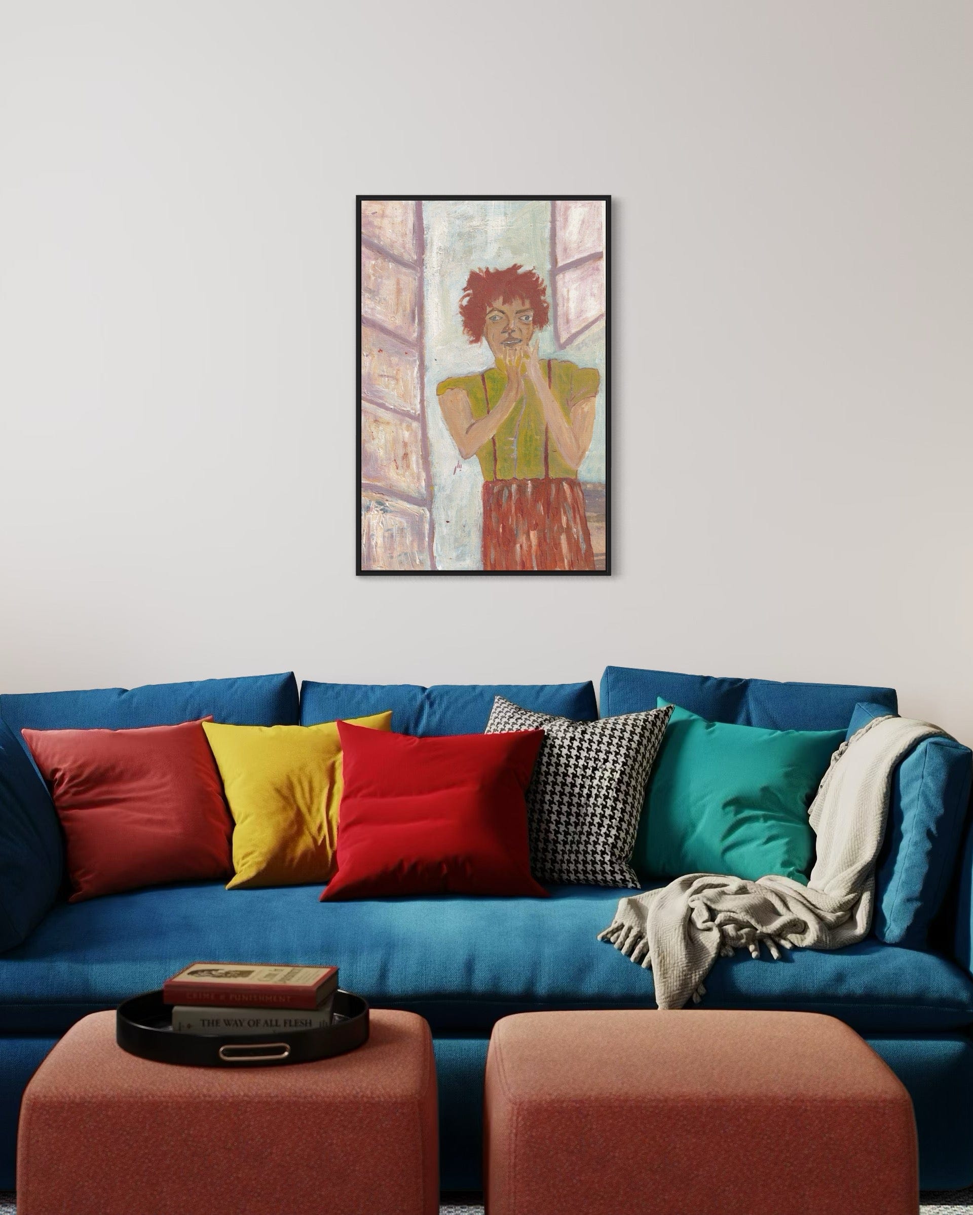 Colorful living room with a blue sofa, multicolored pillows, and a framed painting on the wall.