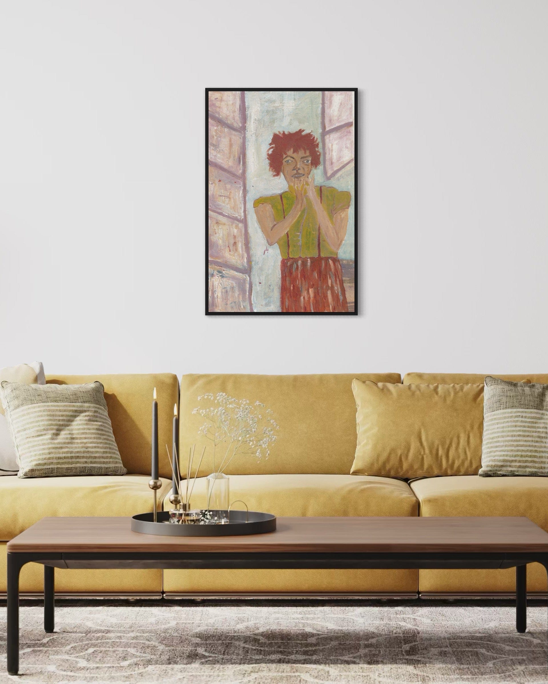 Framed artwork above a yellow sofa in a living room setting
