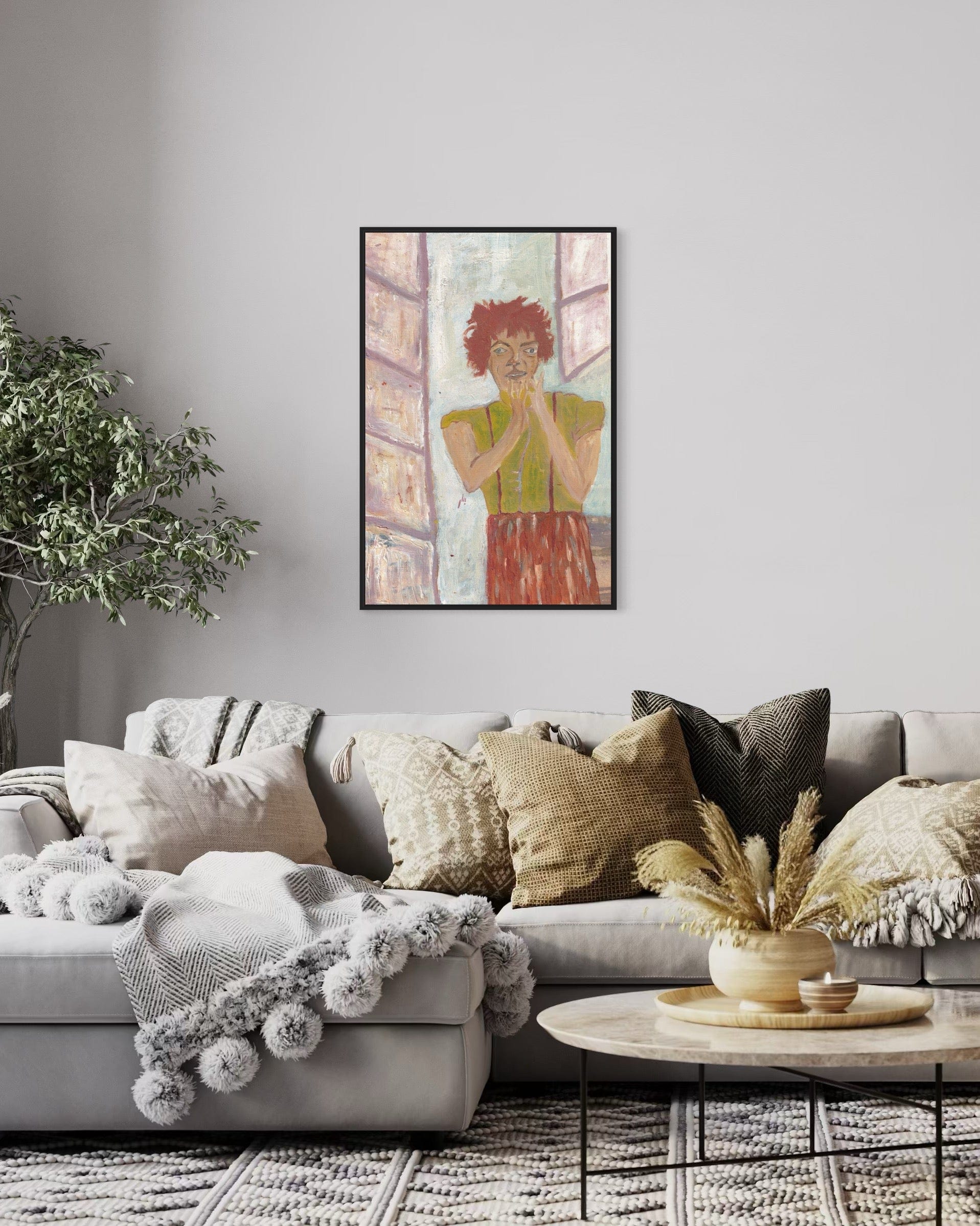 Living room with a gray sofa, decorative pillows, and a framed painting on the wall.