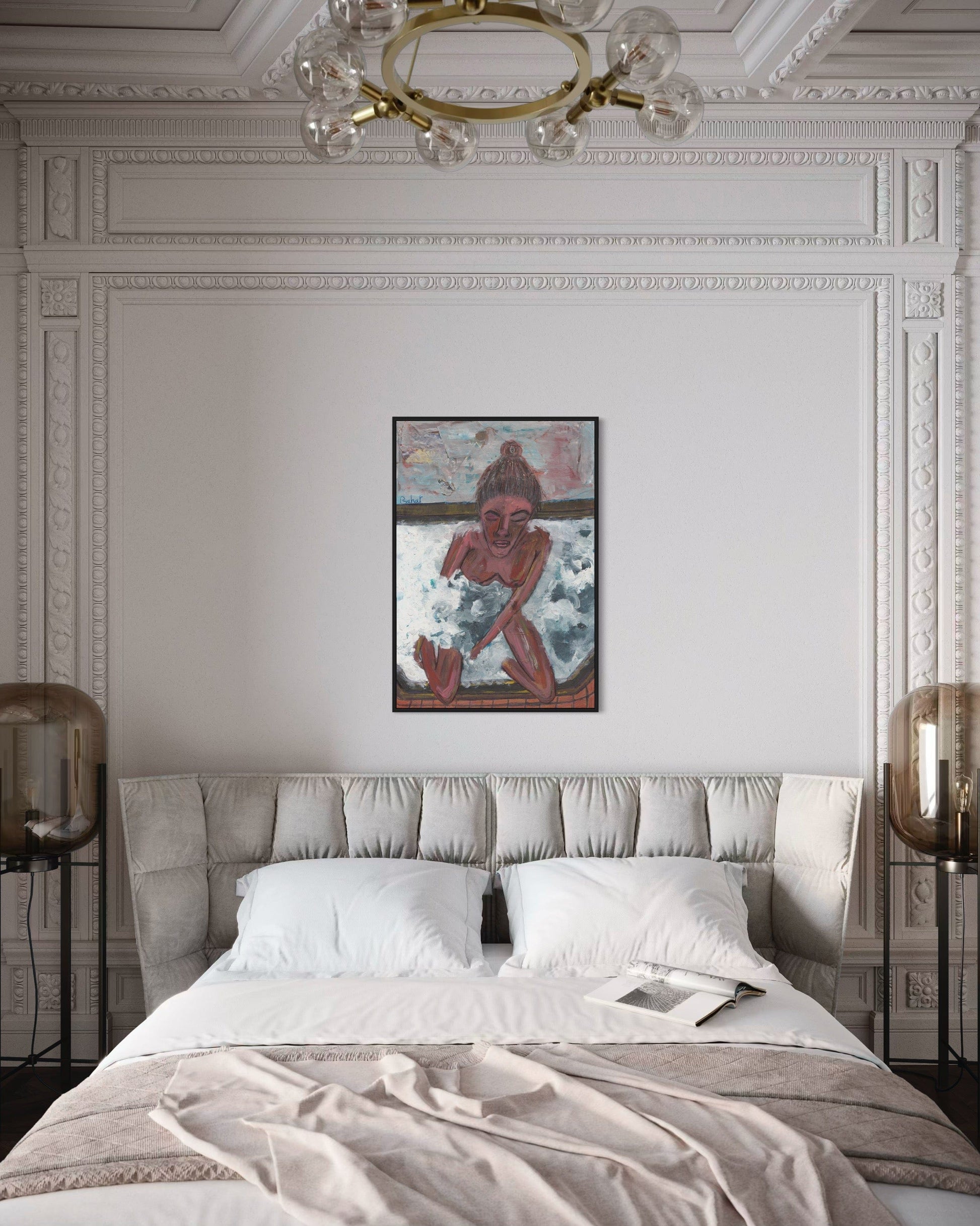 Neatly made bed in a bedroom with decorative wall art and lighting.